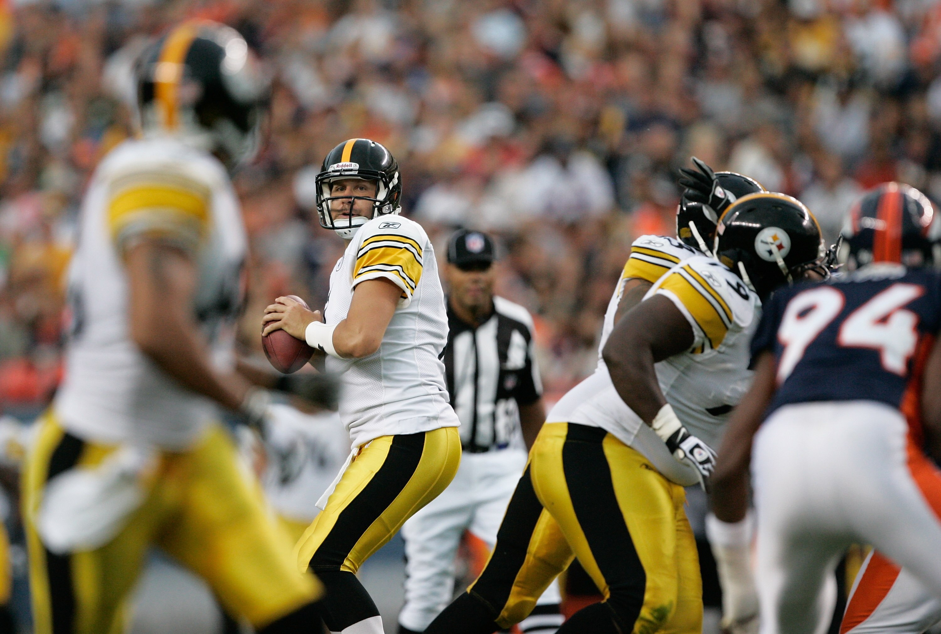 DENVER - AUGUST 29:  Quarterback Ben Roethlisberger #7 of the Pittsburgh Steelers drops back to pass against the Denver Broncos at INVESCO Field at Mile High on August 29, 2010 in Denver, Colorado.  (Photo by Justin Edmonds/Getty Images)