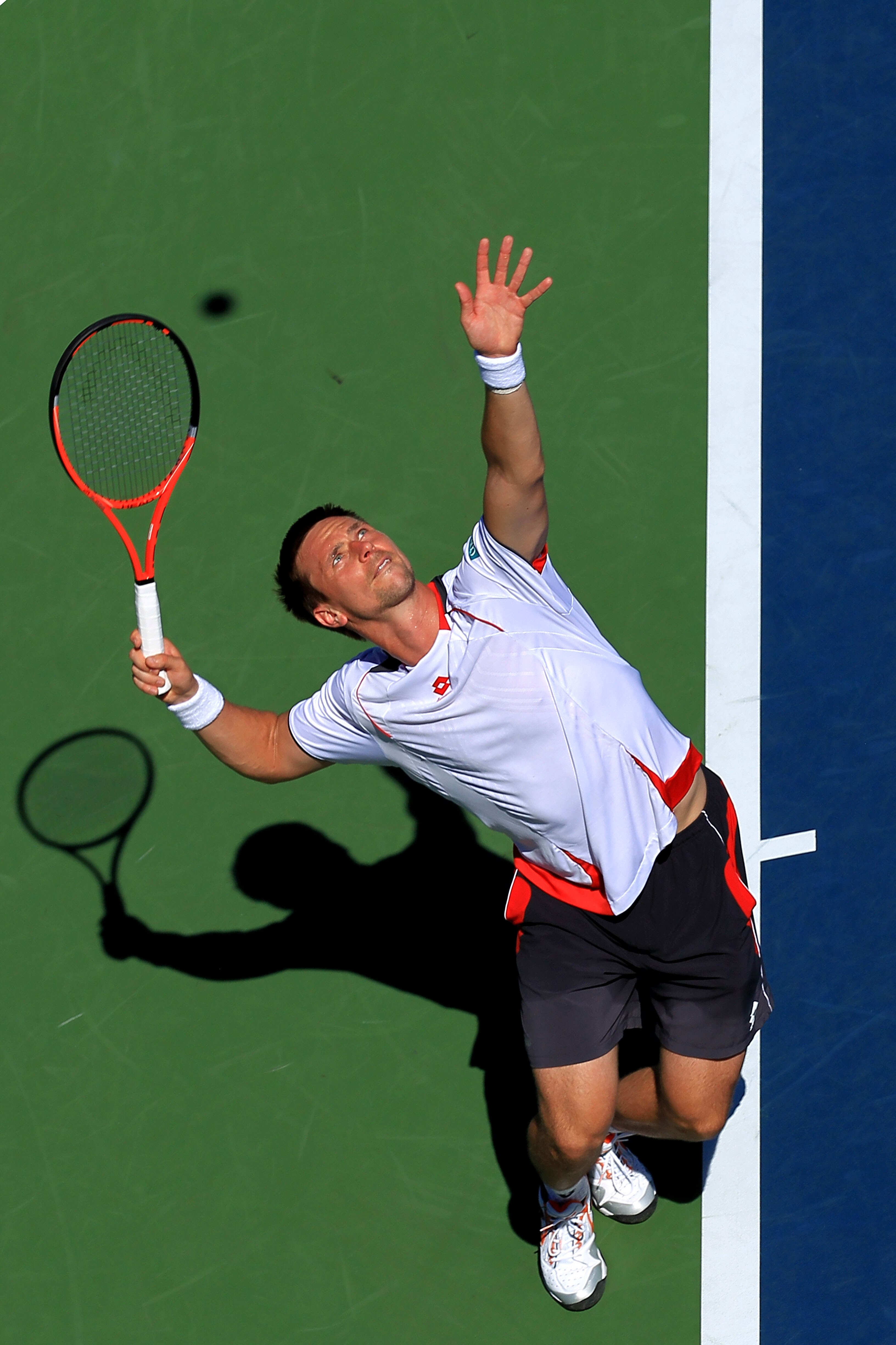 NEW YORK - AUGUST 30: Robin Soderling of Sweden serves against Andreas Haider-Maurer of Austria during the Men's Singles first round match on day one of the 2010 U.S. Open at the USTA Billie Jean King National Tennis Center on August 30, 2010 in the Flus NEW YORK - AUGUST 30: Robin Soderling of Sweden serves against Andreas Haider-Maurer of Austria during the Men's Singles first round match on day one of the 2010 U.S. Open at the USTA Billie Jean King National Tennis Center on August 30, 2010 in the Flus