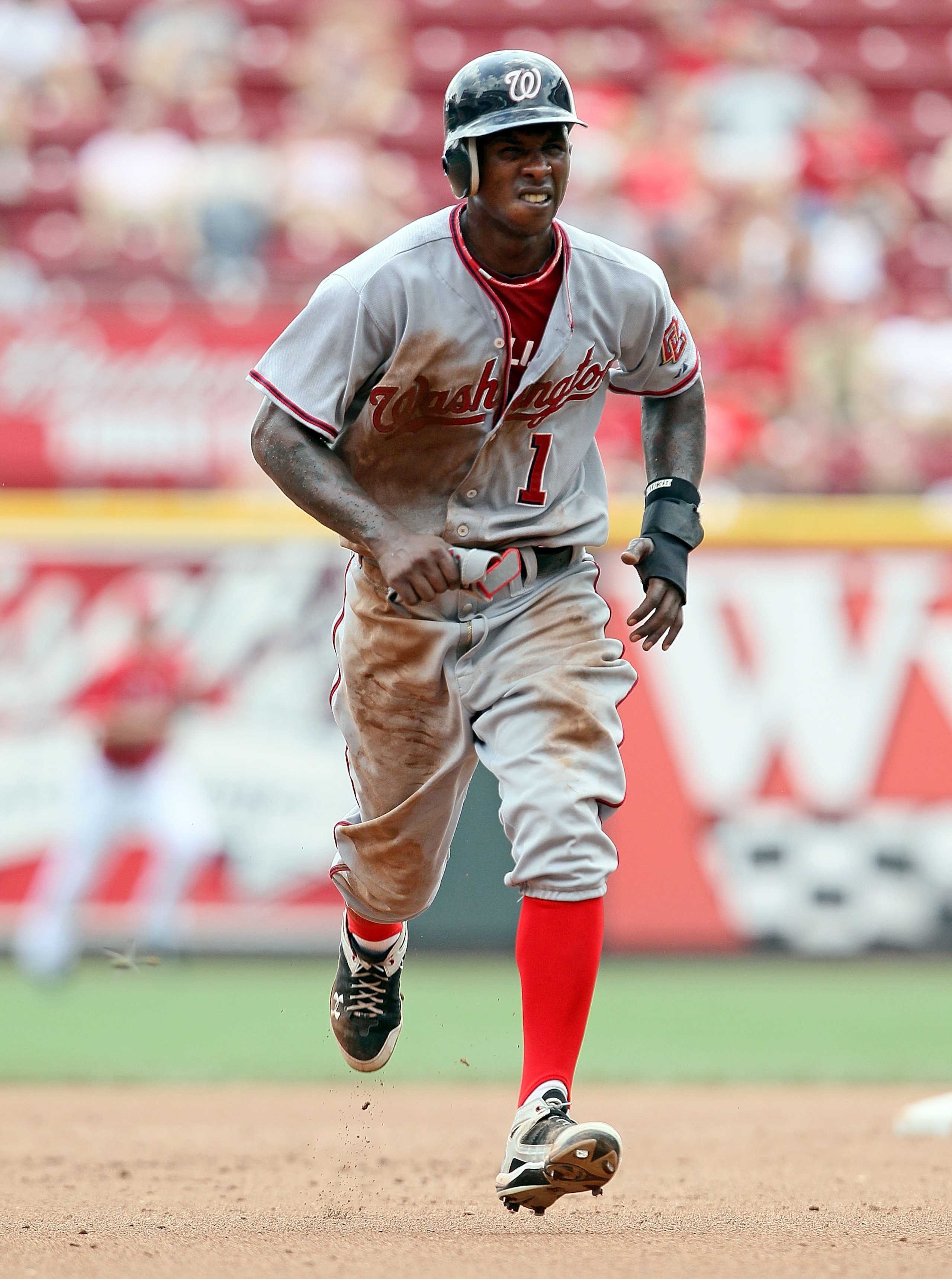CINCINNATI - JULY 22:  Nyjer Morgan #1 of the Washington Nationals runs to third base during the game against the Cincinnati Reds at Great American Ball Park on July 22, 2010 in Cincinnati, Ohio.  (Photo by Andy Lyons/Getty Images)