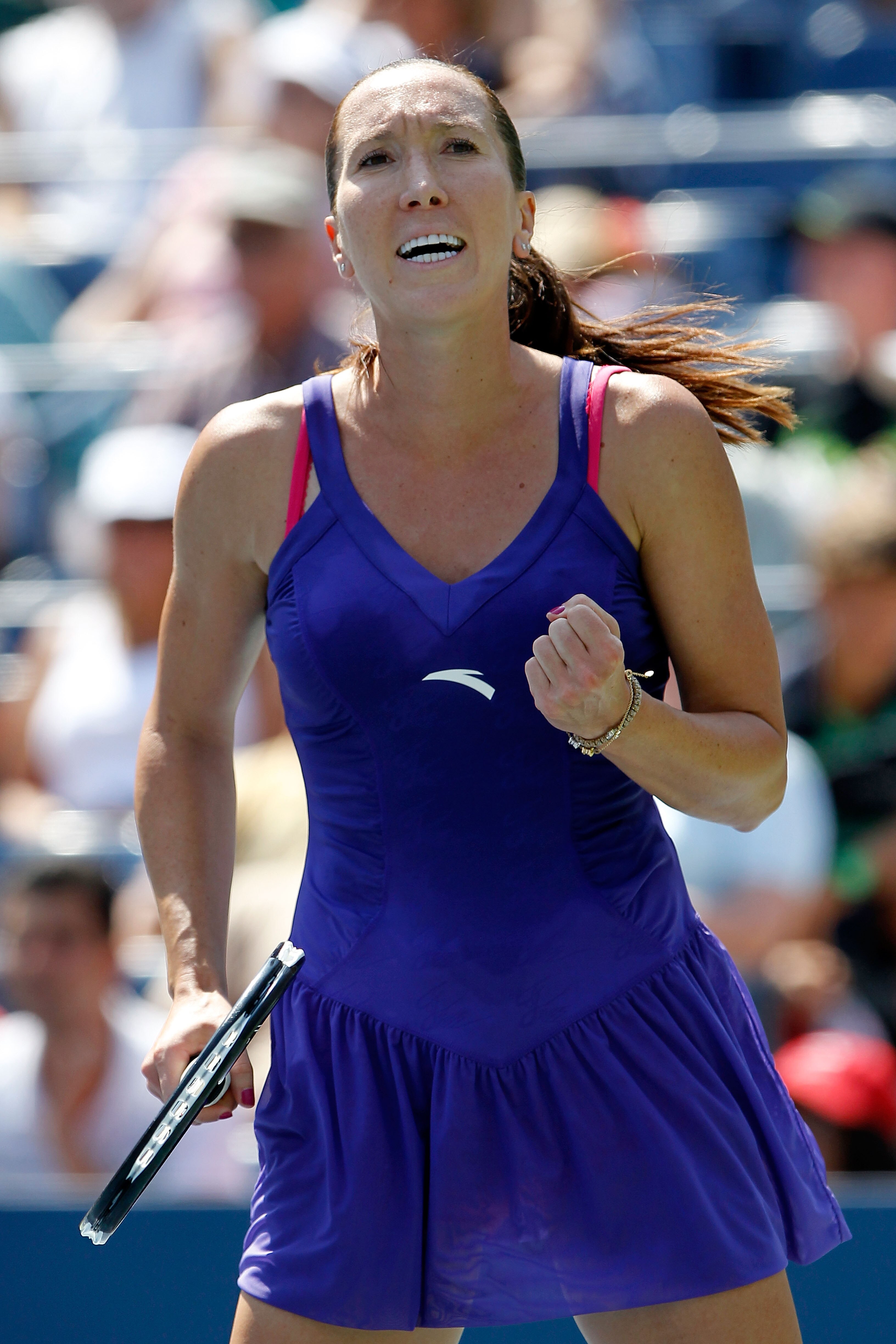 NEW YORK - AUGUST 31: Jelena Jankovic of Serbia reacts after defeating Simona Halep of Romania during her first round women's single match on day two of the 2010 U.S. Open at the USTA Billie Jean King National Tennis Center on August 31, 2010 in the Flus NEW YORK - AUGUST 31: Jelena Jankovic of Serbia reacts after defeating Simona Halep of Romania during her first round women's single match on day two of the 2010 U.S. Open at the USTA Billie Jean King National Tennis Center on August 31, 2010 in the Flus