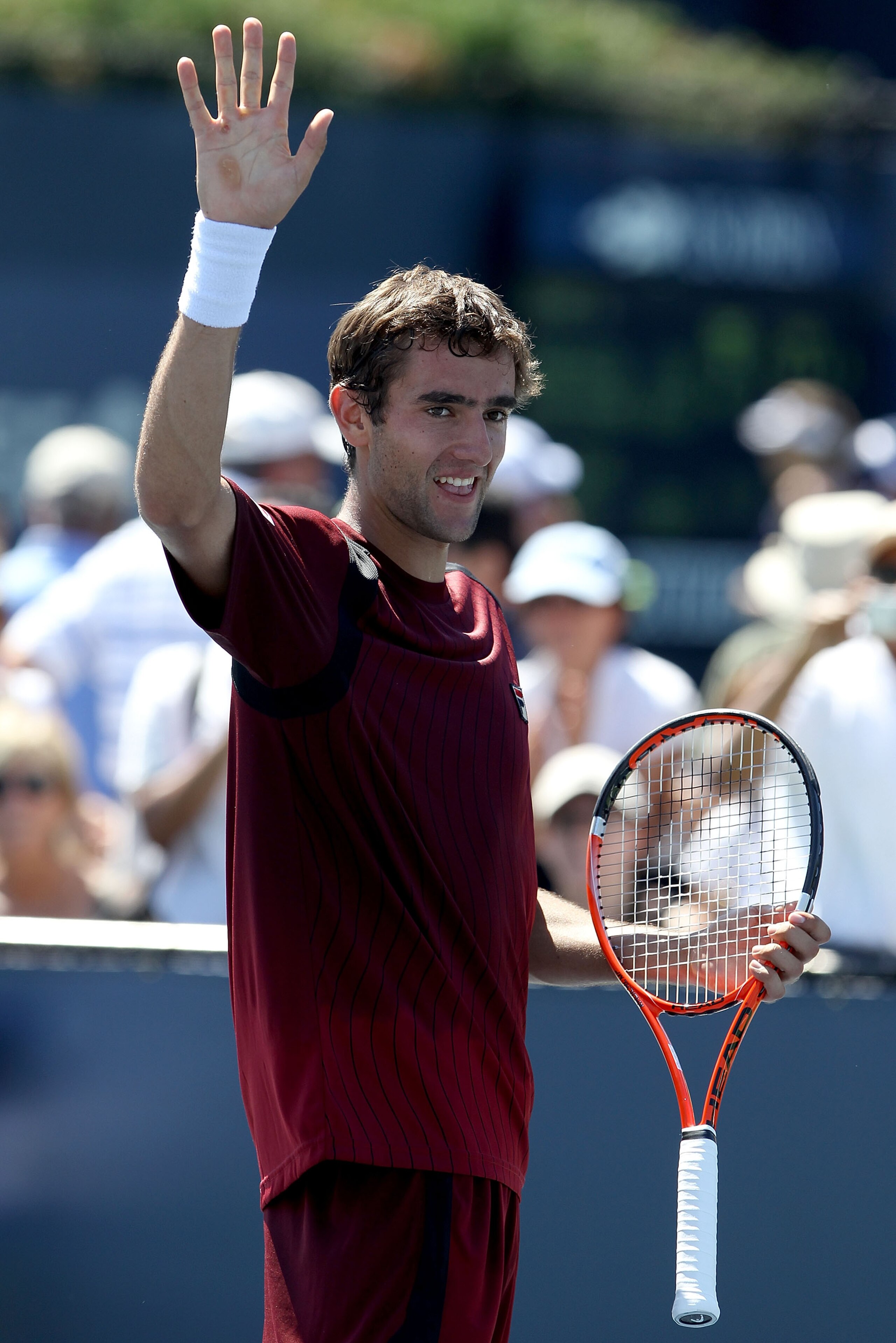NEW YORK - AUGUST 30:  Marin Cilic of Croatia waves to the crowd after winning match point against Illya Marchenko of the Ukraine during the Men's Singles first round match on day one of the 2010 U.S. Open at the USTA Billie Jean King National Tennis Cent
