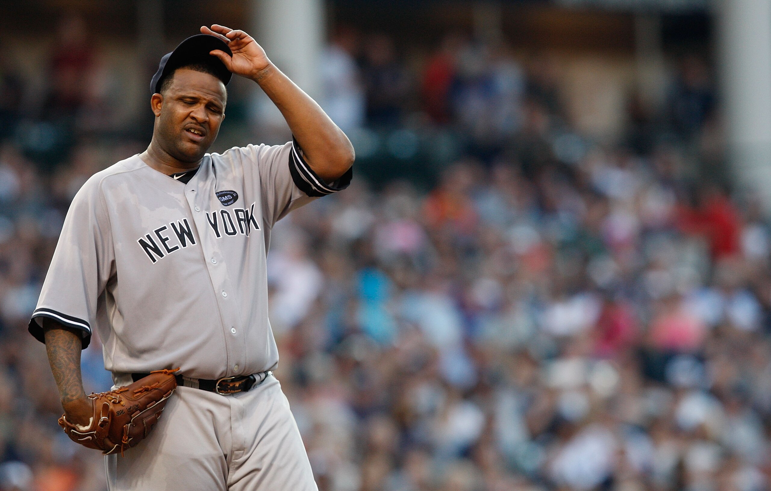 CLEVELAND - JULY 27:  CC Sabathia #52 of the New York Yankees takes a moment inbetween pitches during the game against the Cleveland Indians on July 27, 2010 at Progressive Field in Cleveland, Ohio.  (Photo by Jared Wickerham/Getty Images)