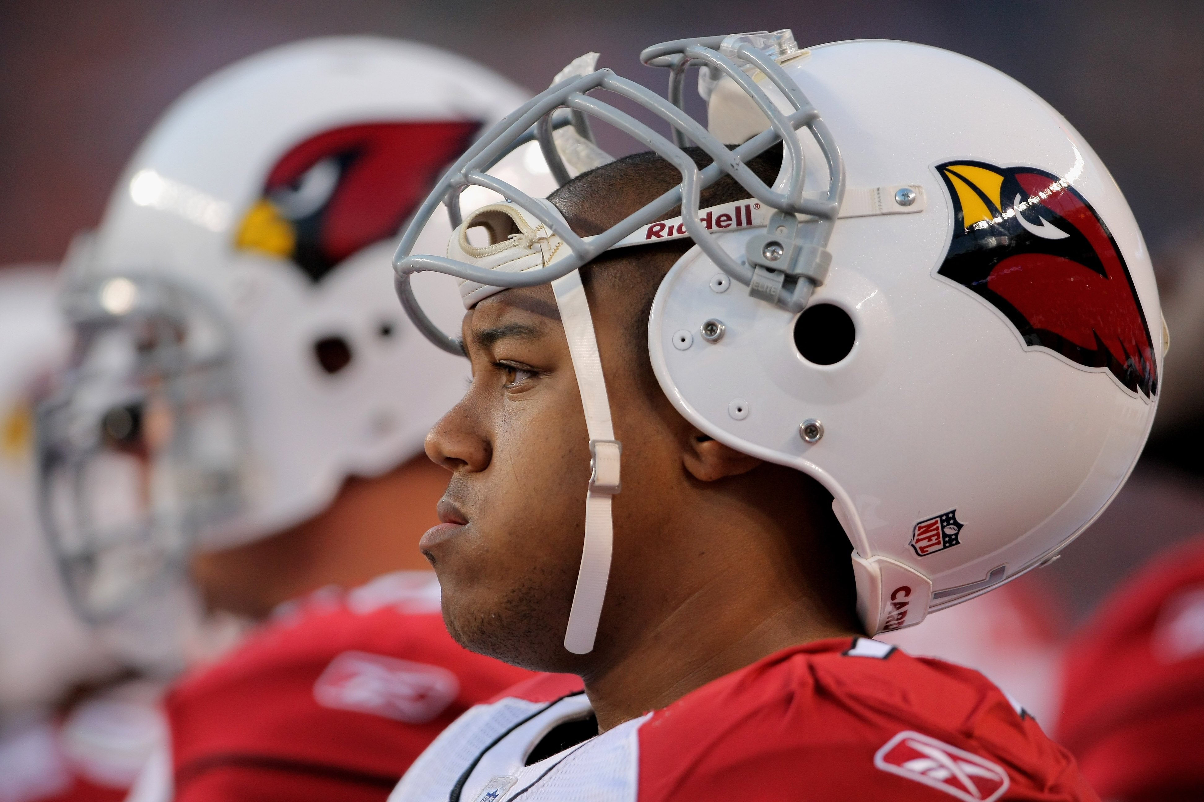DENVER - SEPTEMBER 03:  Guard Reggie Wells #74 of the Arizona Cardinals awaits action on the sidelines against the Denver Broncos during NFL preseason action at Invesco Field at Mile High on September 3, 2009 in Denver, Colorado. The Broncos defeated the 