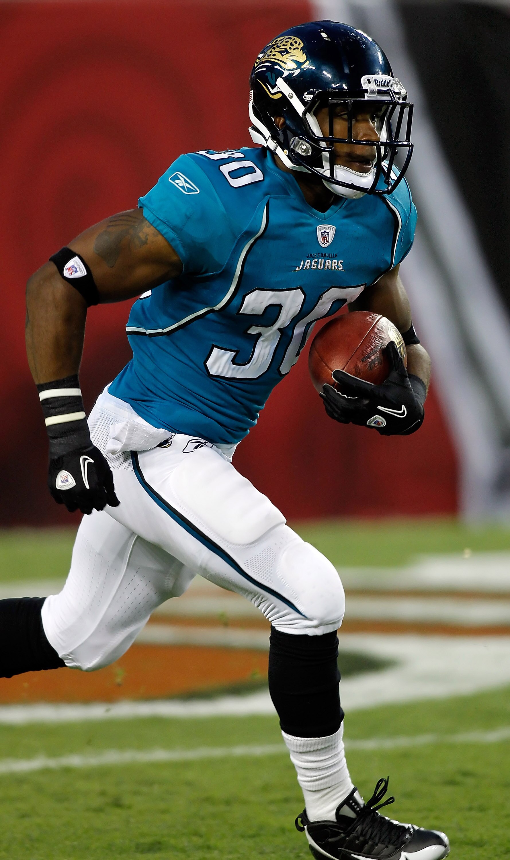 TAMPA, FL - AUGUST 28:  Running back Scotty McGee #30 of the Jacksonville Jaguars runs a kick back against the Tampa Bay Buccaneers during a preseason game at Raymond James Stadium on August 28, 2010 in Tampa, Florida.  (Photo by J. Meric/Getty Images)