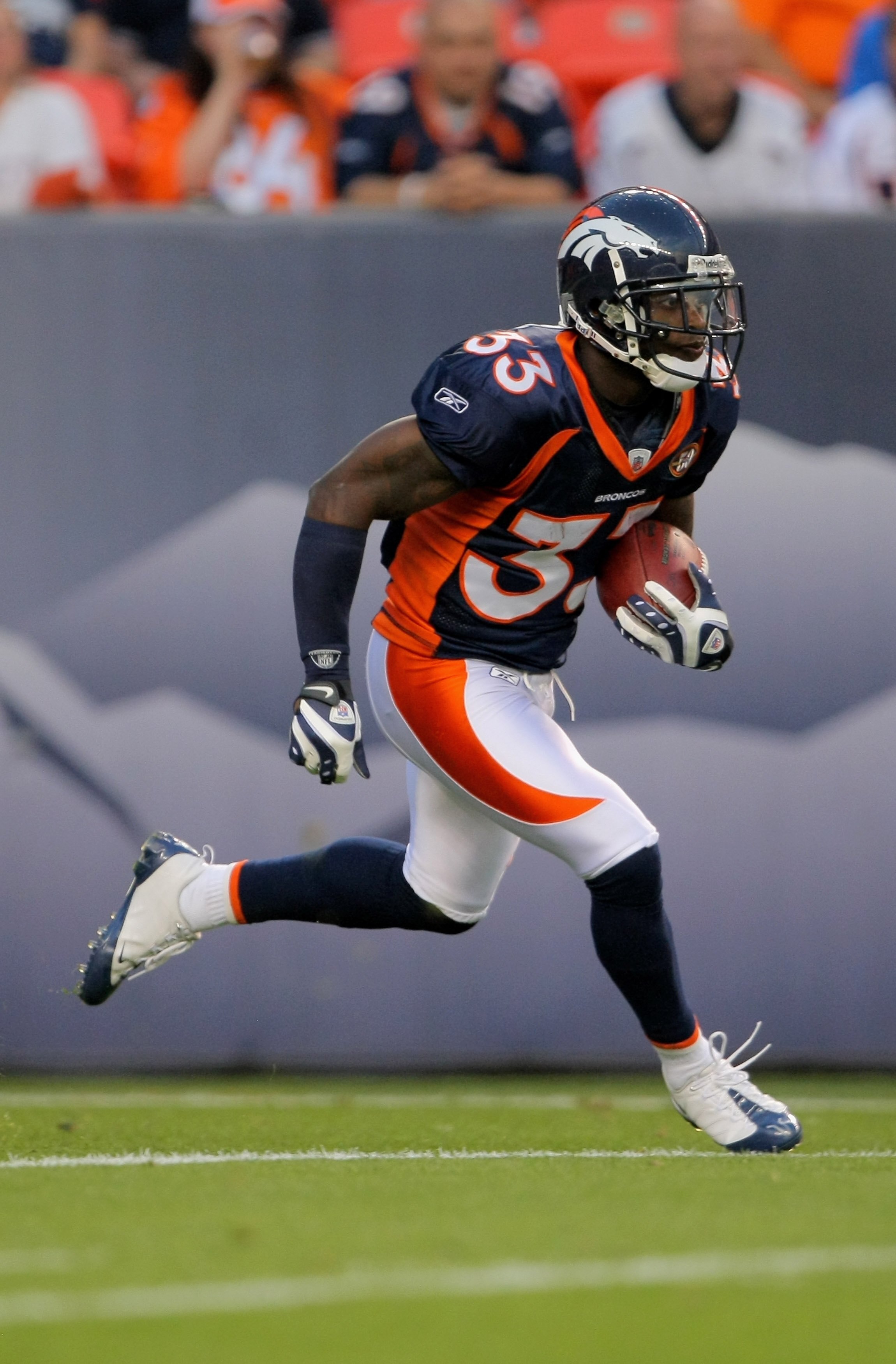 DENVER - SEPTEMBER 03:  Alphonso Smith #33 of the Denver Broncos returns the opening kick off for thirty yards during the NFL preseason game against the Arizona Cardinals at Invesco Field at Mile High on September 3, 2009 in Denver, Colorado. The Broncos 