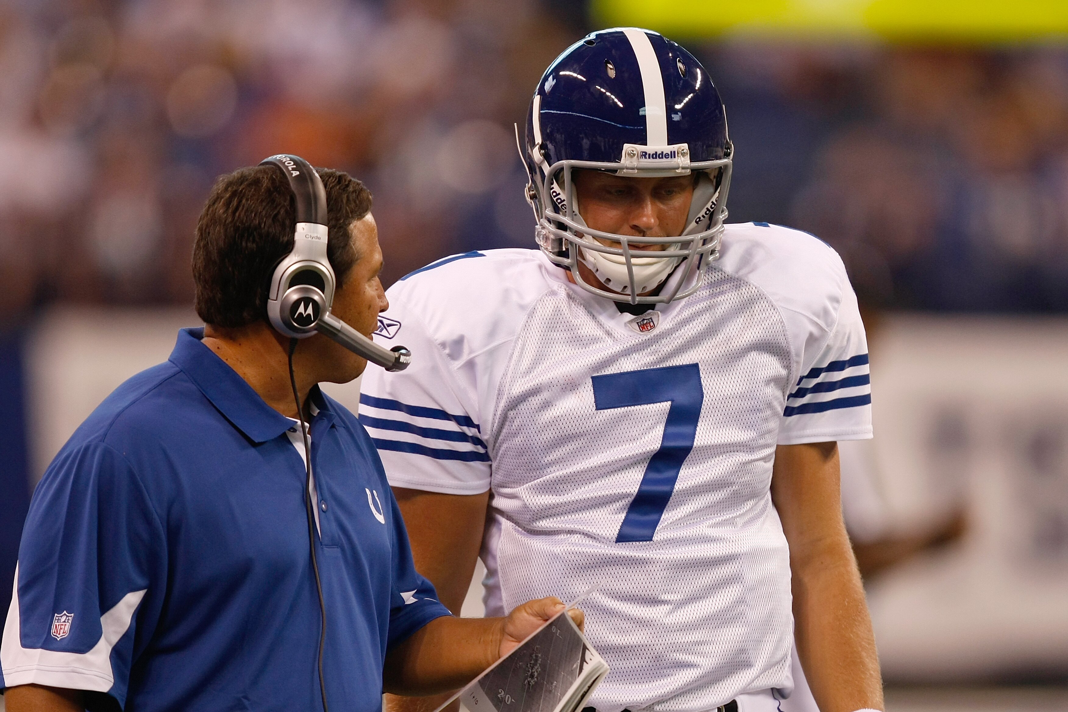 INDIANAPOLIS, IN - AUGUST 15:  Curtis Painter #7 of the Indianapolis Colts talks with a coach during the preseason game against the San Francisco 49ers at Lucas Oil Stadium on August 15, 2010 in Indianapolis, Indiana.  (Photo by Scott Boehm/Getty Images)