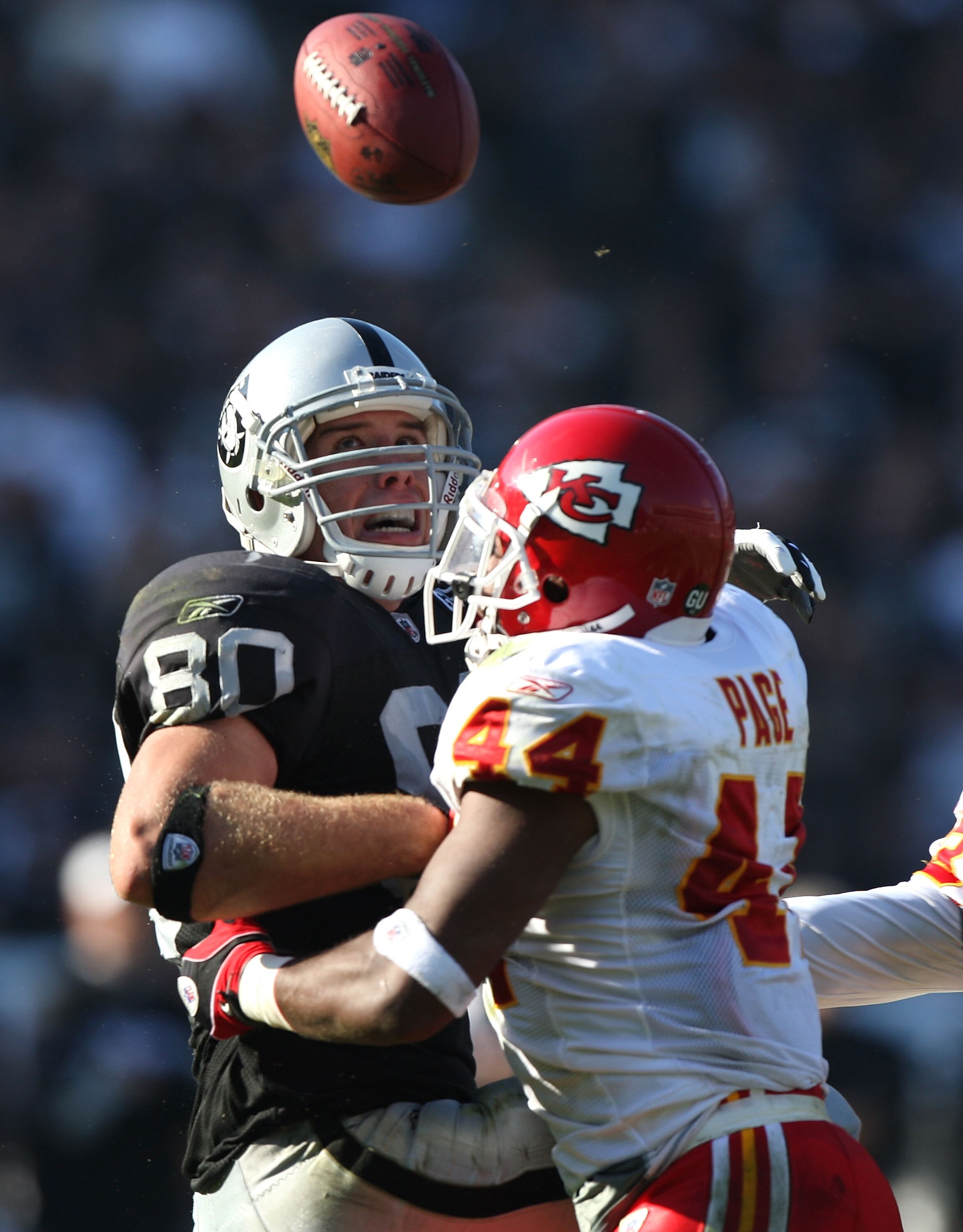 OAKLAND, CA - NOVEMBER 30: Jarrad Page #44 of the Kansas City Chiefs breaks up a pass to Zach Miller #80 of the Oakland Raiders during an NFL game on November 30, 2008 at the Oakland-Alameda County Coliseum in Oakland, California. (Photo by Jed Jacobsohn/