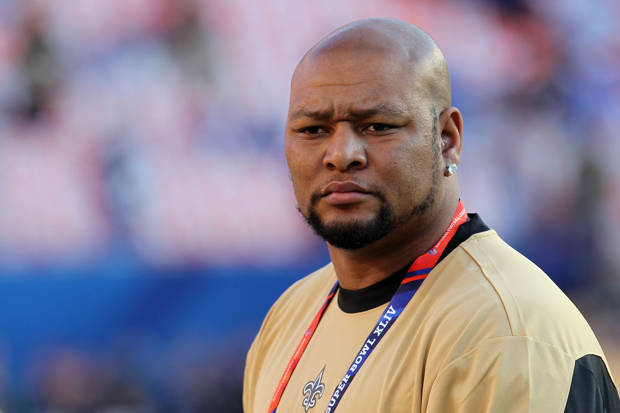 MIAMI GARDENS, FL - FEBRUARY 07: Former New Orleans Saints player Deuce McAllister watches teams warm up on the field prior to Super Bowl between the Indianapolis Colts and the New Orleans Saints on February 7, 2010 at Sun Life Stadium in Miami Gardens, F