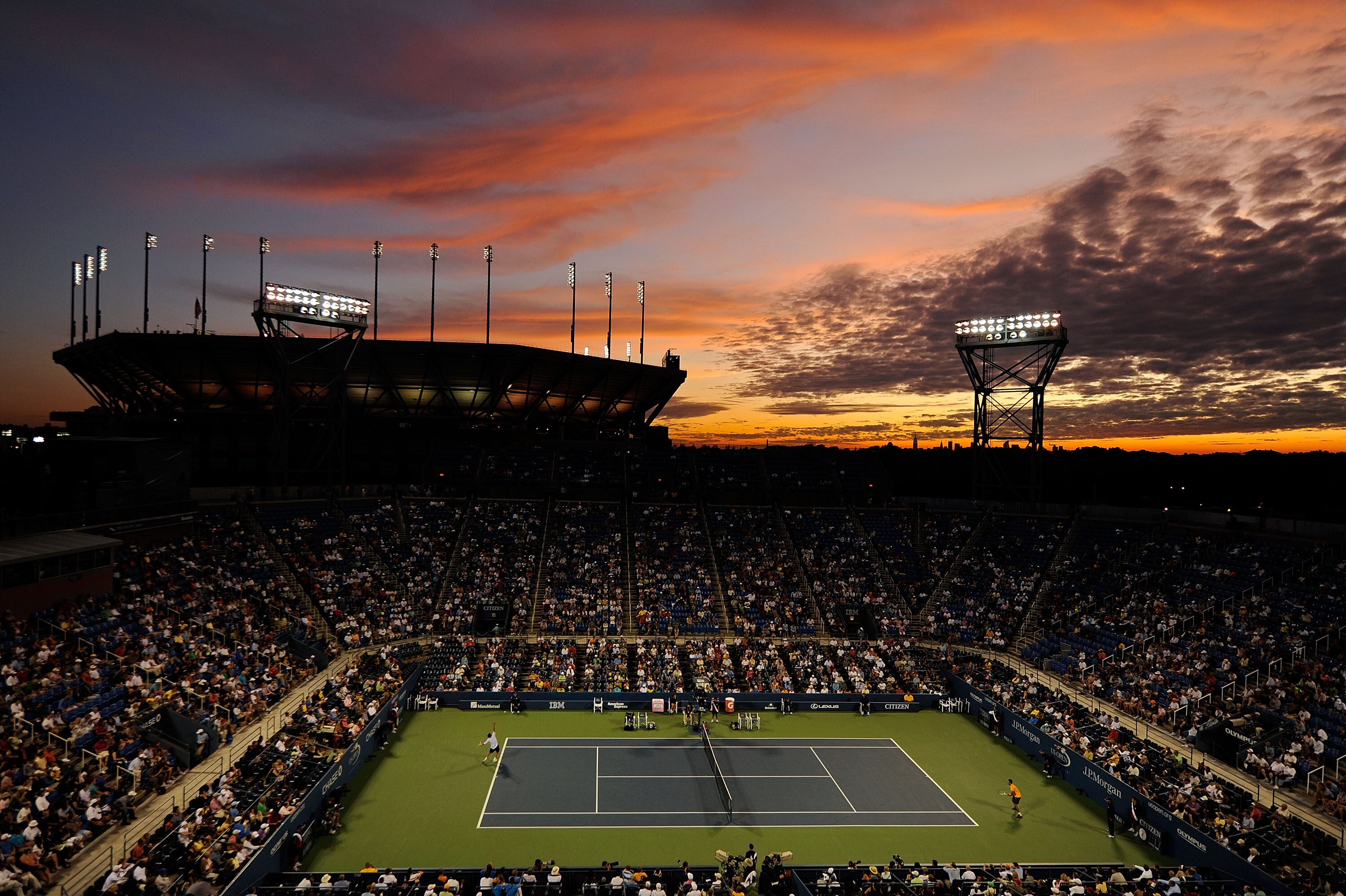NEW YORK - SEPTEMBER 03:  A general view of the sunset over Arthur Ashe Stadium as Novak Djokovic of Serbia plays Carsten Ball of Australia in Louis Armstrong Stadium during day four of the 2009 U.S. Open at the USTA Billie Jean King National Tennis Cente