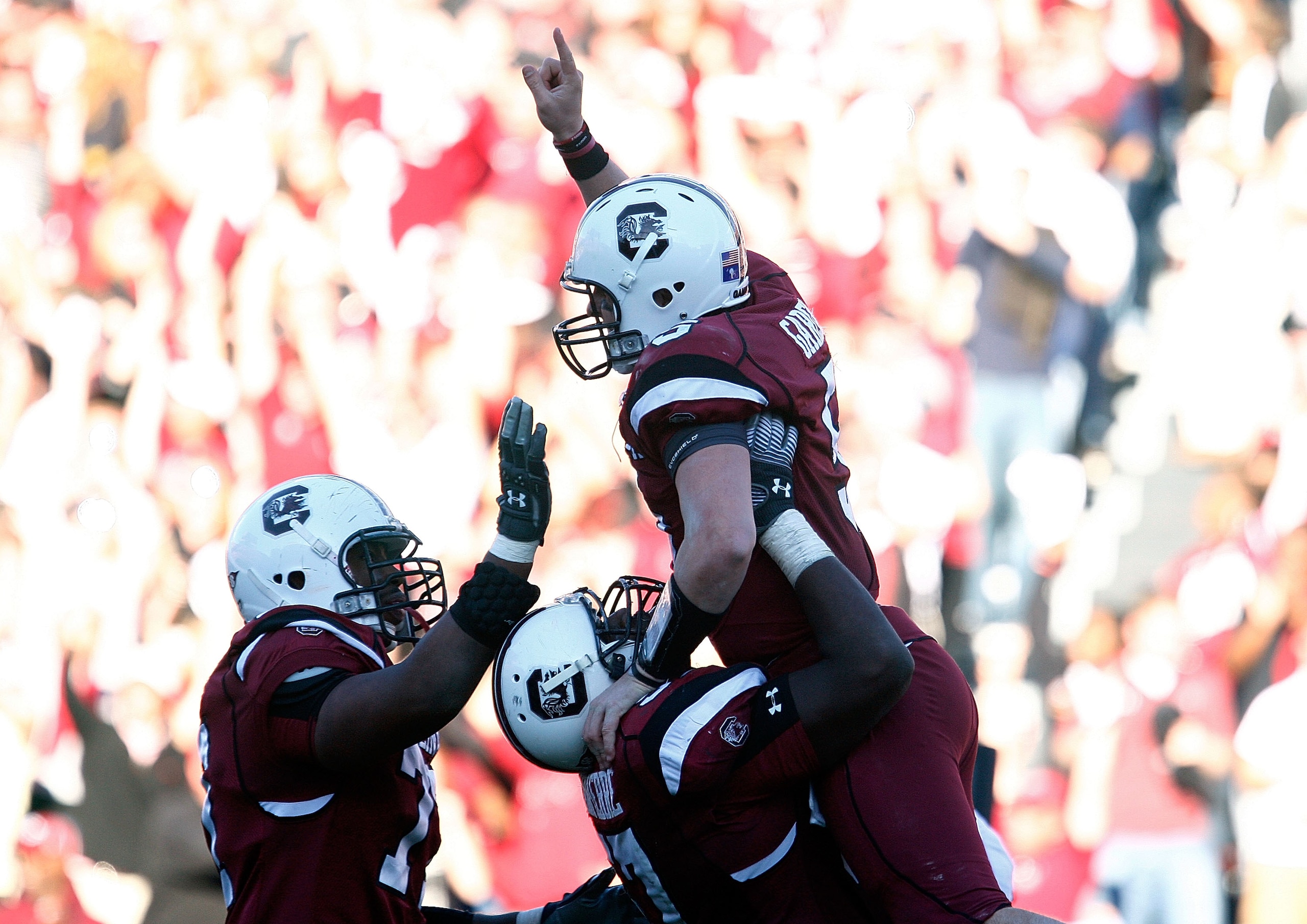 COLUMBIA, SC - NOVEMBER 28:  Stephen Garcia #5 of the South Carolina Gamecocks celebrates a second half touchdown with his temmates against the Clemson Tigers at Williams-Brice Stadium on November 28, 2009 in Columbia, South Carolina.  (Photo by Scott Hal