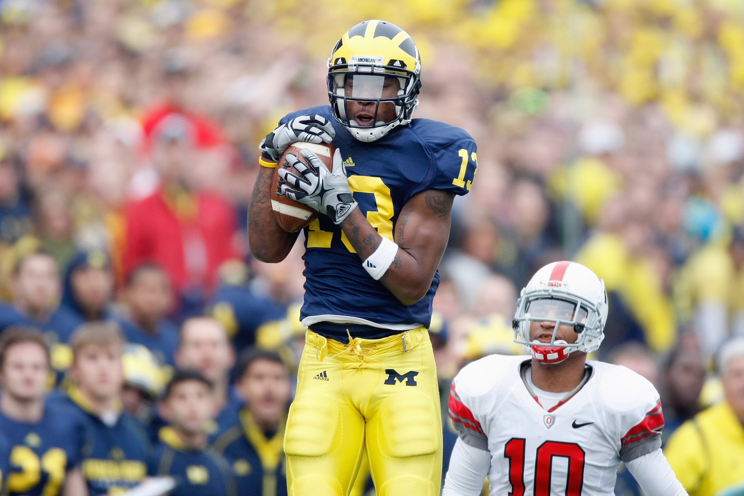ANN ARBOR, MI - NOVEMBER 21:  Greg Mathews #13 of the Michigan Wolverines catches the pass during the game against the Ohio State Buckeyes on November 21, 2009 at Michigan Stadium in Ann Arbor, Michigan. Ohio State won the game 21-10. (Photo by Gregory Sh