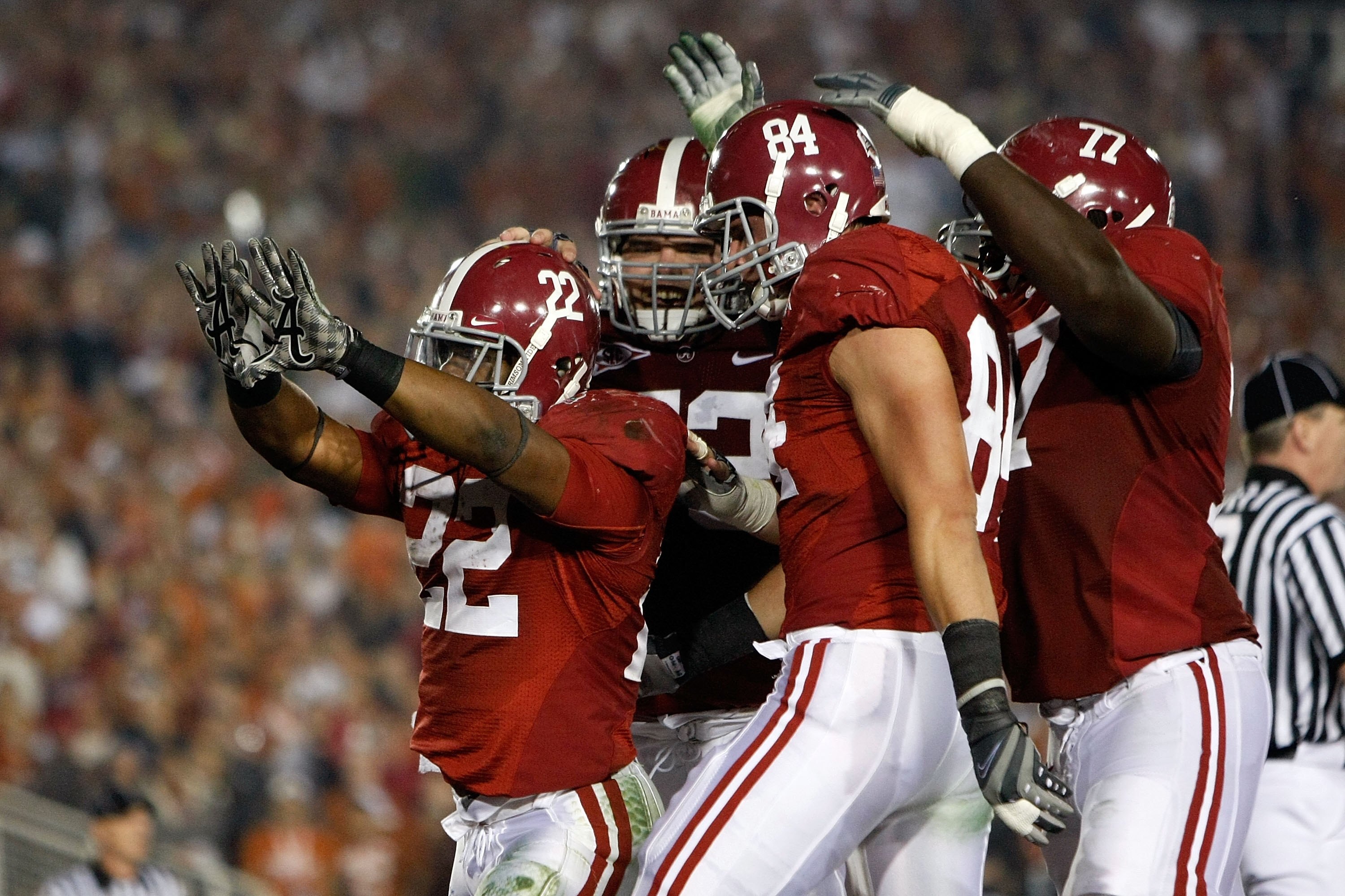 PASADENA, CA - JANUARY 07:  Running back Mark Ingram #22 of the Alabama Crimson Tide celebrates a touchdown with teammates against the Texas Longhorns in the second quarter of the Citi BCS National Championship game at the Rose Bowl on January 7, 2010 in