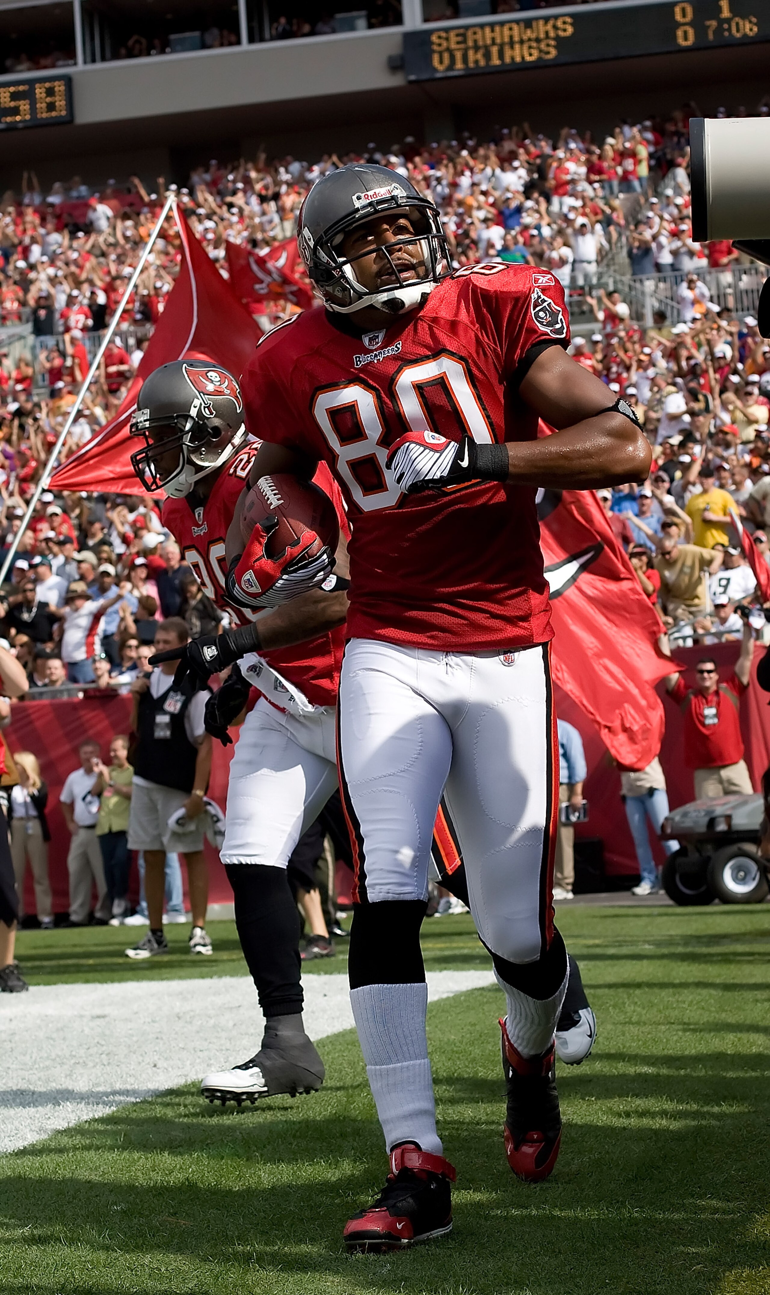TAMPA, FL - NOVEMBER 22:  Receiver Michael Clayton #80 of the Tampa Bay Buccaneers celebrates his first quarter touchdown against the New Orleans Saints during the game at Raymond James Stadium on November 22, 2009 in Tampa, Florida.  (Photo by J. Meric/G
