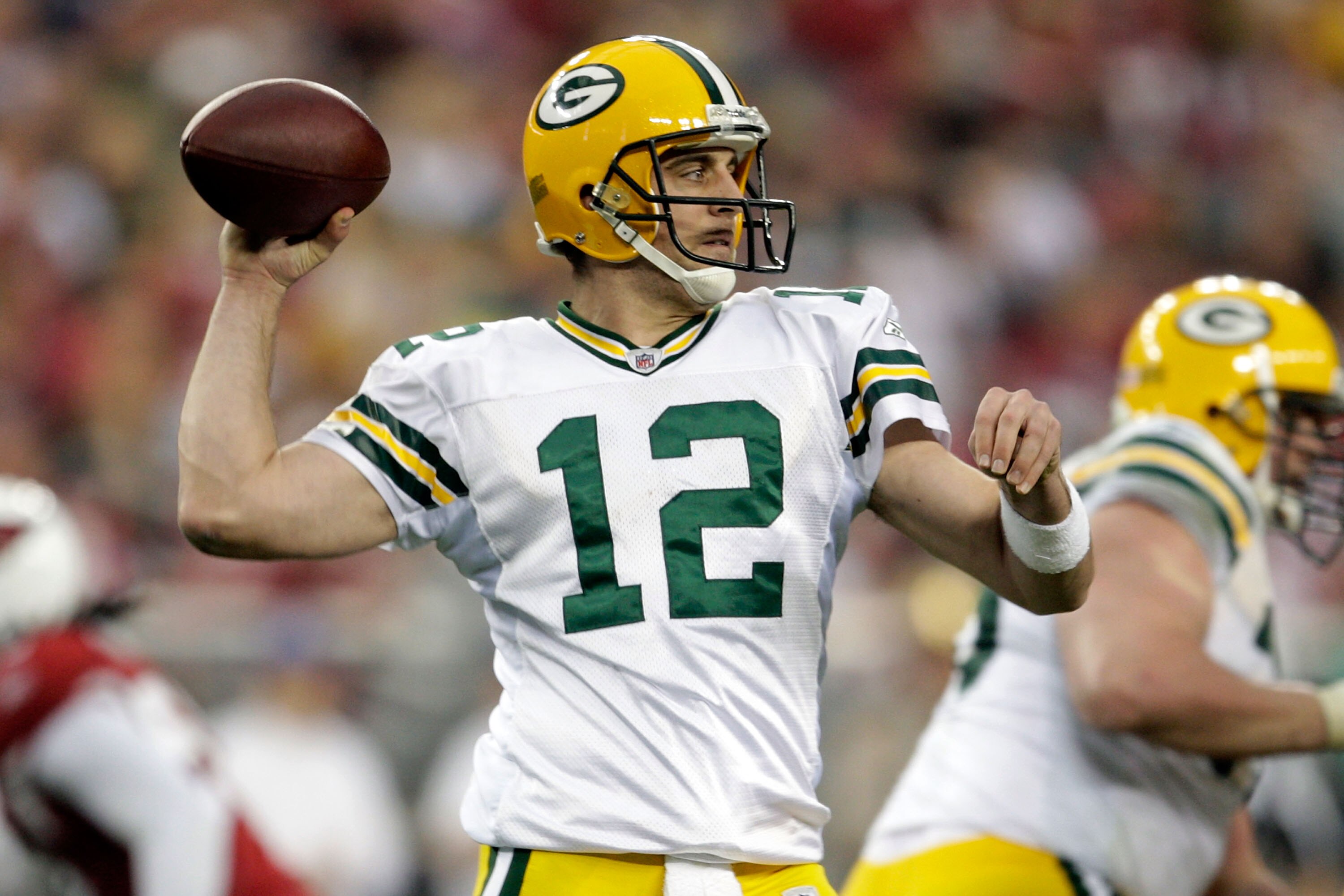 GLENDALE, AZ - JANUARY 03:  Aaron Rodgers #12 of the Green Bay Packers throws the ball in the second half against the Arizona Cardinals at University of Phoenix Stadium on January 3, 2010 in Glendale, Arizona.  (Photo by Jamie Squire/Getty Images)