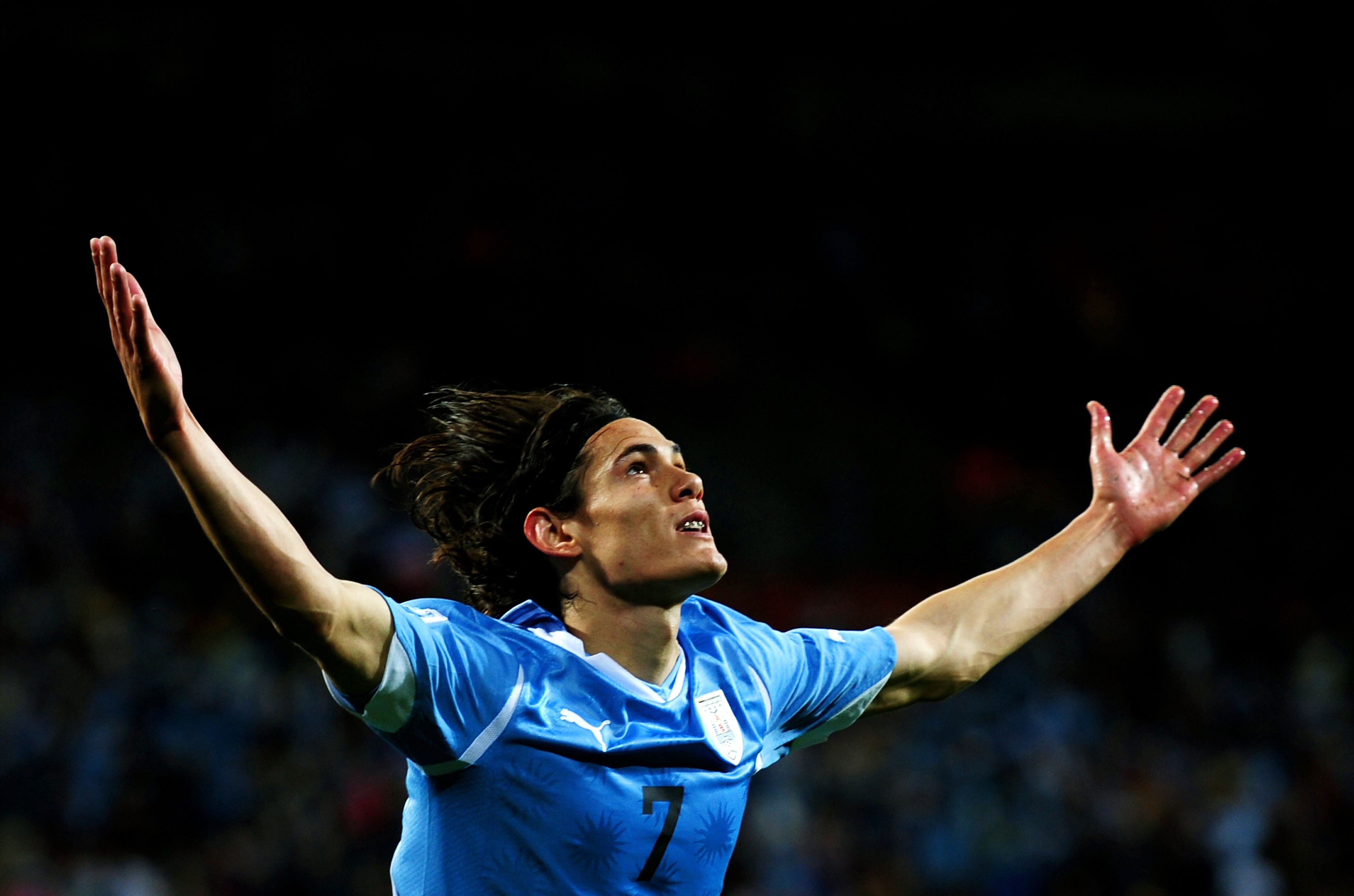 PORT ELIZABETH, SOUTH AFRICA - JULY 10:  Edinson Cavani of Uruguay celebrates scoring his team's first goal during the 2010 FIFA World Cup South Africa Third Place Play-off match between Uruguay and Germany at The Nelson Mandela Bay Stadium on July 10, 20