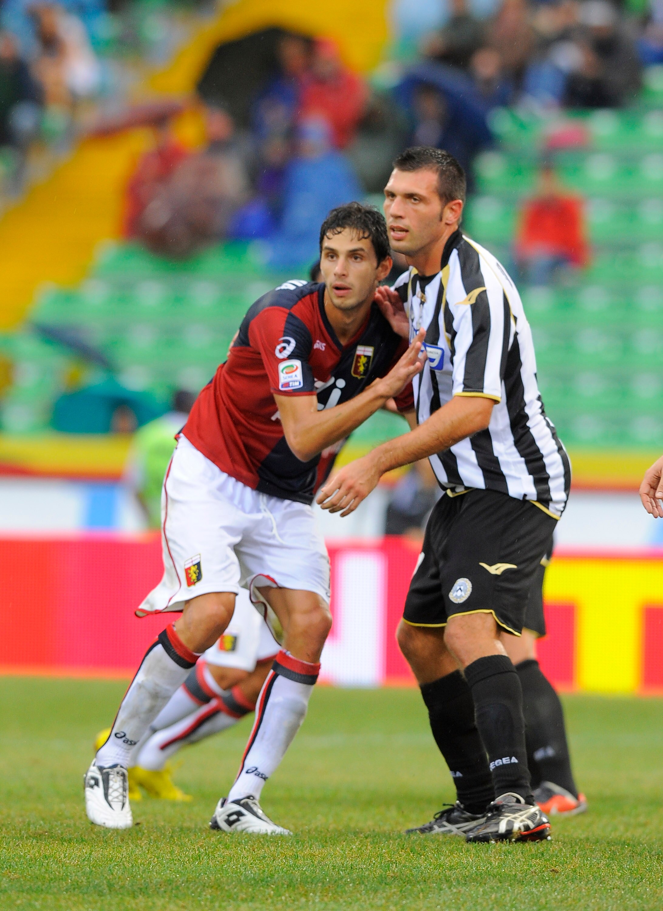 UDINE, ITALY - AUGUST 28:  (R-L) Maurizio Domizzi of Udinese competes with Andrea Ranocchia of Genoa during the Serie A match between Udinese and Genoa at Stadio Friuli on August 28, 2010 in Udine, Italy.  (Photo by Dino Panato/Getty Images)