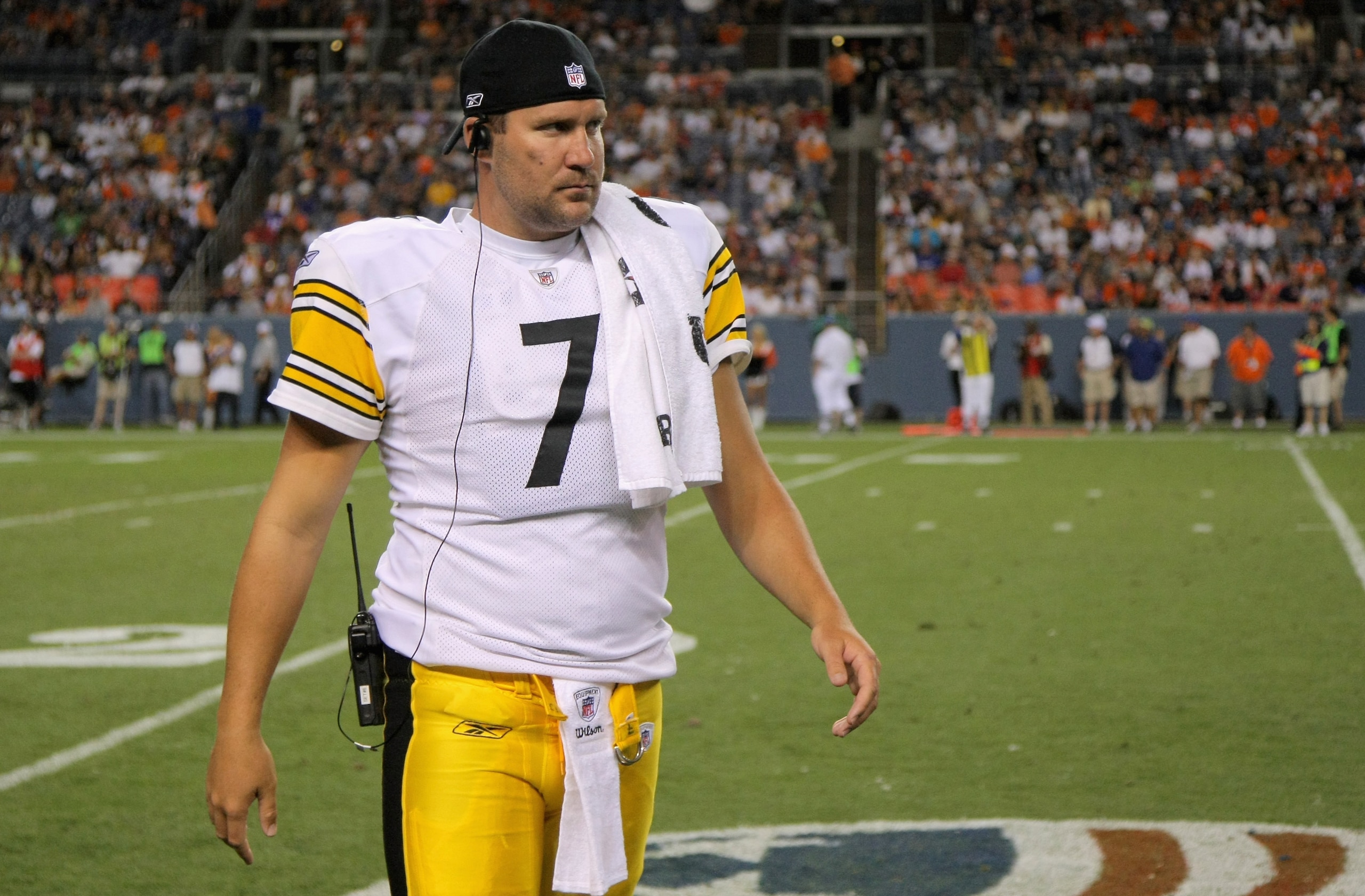 DENVER - AUGUST 29:  Quarterback Ben Rothlisberger #7 of the Pittsburgh Steelers looks on from the sidelines against the Denver Broncos during preseason NFL action at INVESCO Field at Mile High on August 29, 2010 in Denver, Colorado. The Broncos defeated