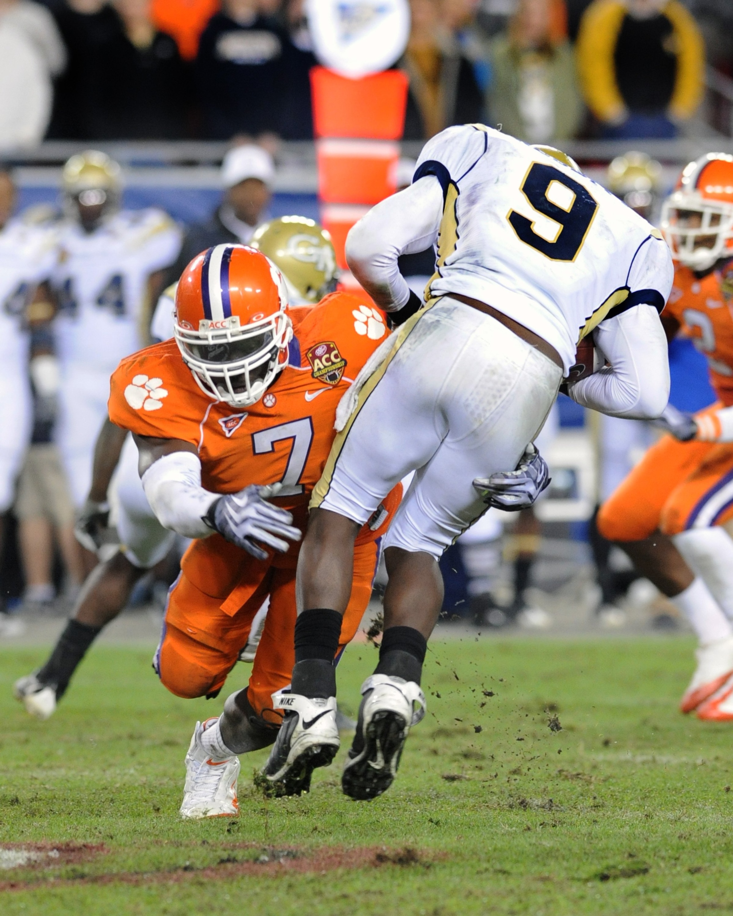 TAMPA, FL - NOVEMBER 28: Defensive end Ricky Sapp #7 of the Clemson Tigers tackles quarterback Josh Nesbitt #9 of the Georgia Tech Yellow Jackets in the 2009 ACC Football Championship Game December 5, 2009 at Raymond James Stadium in Tampa, Florida.  (Pho