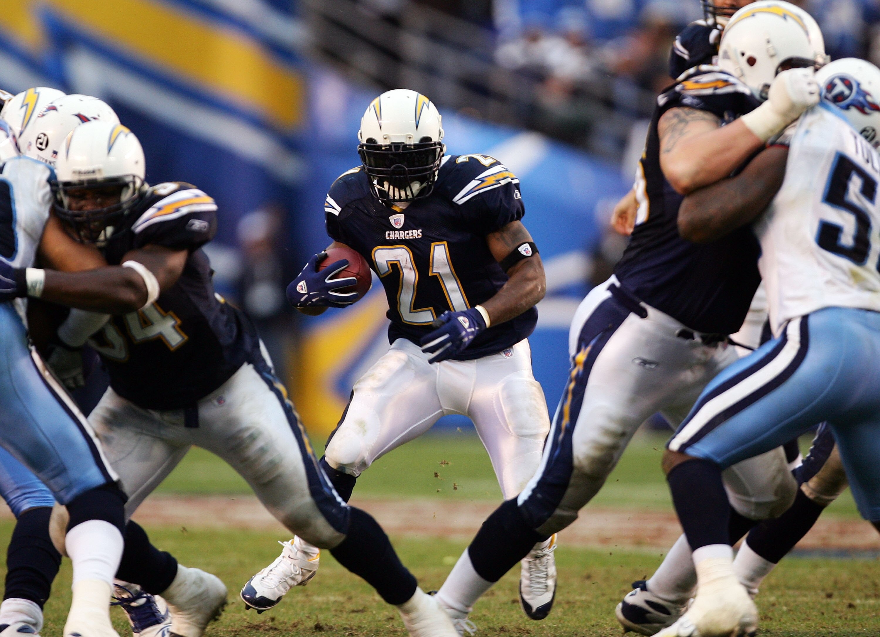 SAN DIEGO - JANUARY 06:  LaDanian Tomlinson #21 of the San Diego Chargers runs for yardage against the Tennessee Titans in the second half during their AFC Wild Card Playoff Game at Qualcomm Stadium on January 6, 2008 in San Diego, California. The Charger