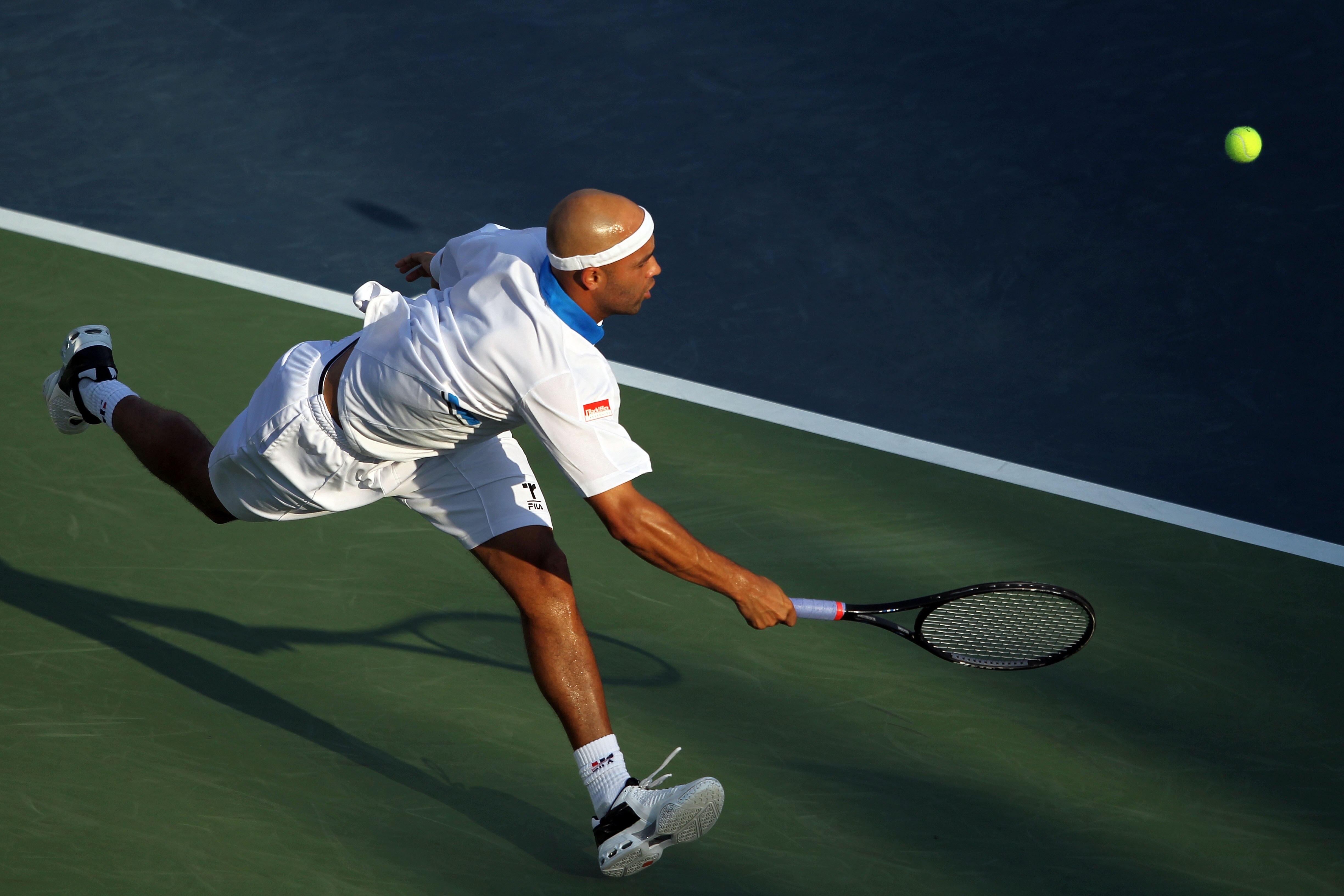 NEW YORK - SEPTEMBER 02:  James Blake of the United States hits a forehand return shot against Peter Polansky of Canada during his men's singles match on day four of the 2010 U.S. Open at the USTA Billie Jean King National Tennis Center on September 2, 20