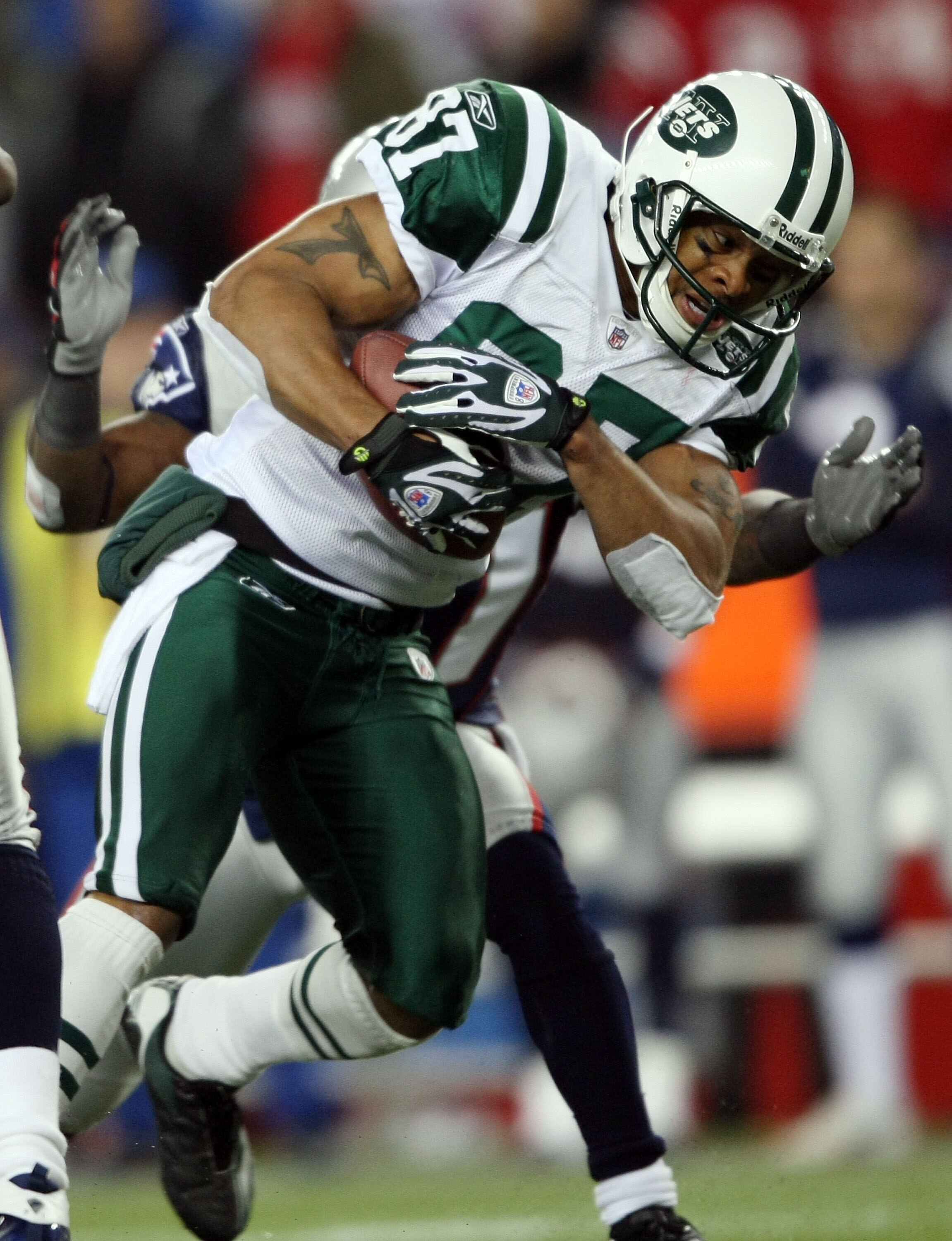 FOXBORO, MA - NOVEMBER 13: Laveranues Coles #87 of the New York Jets is pulled down by James Sanders #36 of the New England Patriots on November 13, 2008 at Gillette Stadium in Foxboro, Massachusetts. The Jets defeated the Patriots 34-31 in overtime. (P FOXBORO, MA - NOVEMBER 13: Laveranues Coles #87 of the New York Jets is pulled down by James Sanders #36 of the New England Patriots on November 13, 2008 at Gillette Stadium in Foxboro, Massachusetts. The Jets defeated the Patriots 34-31 in overtime. (P