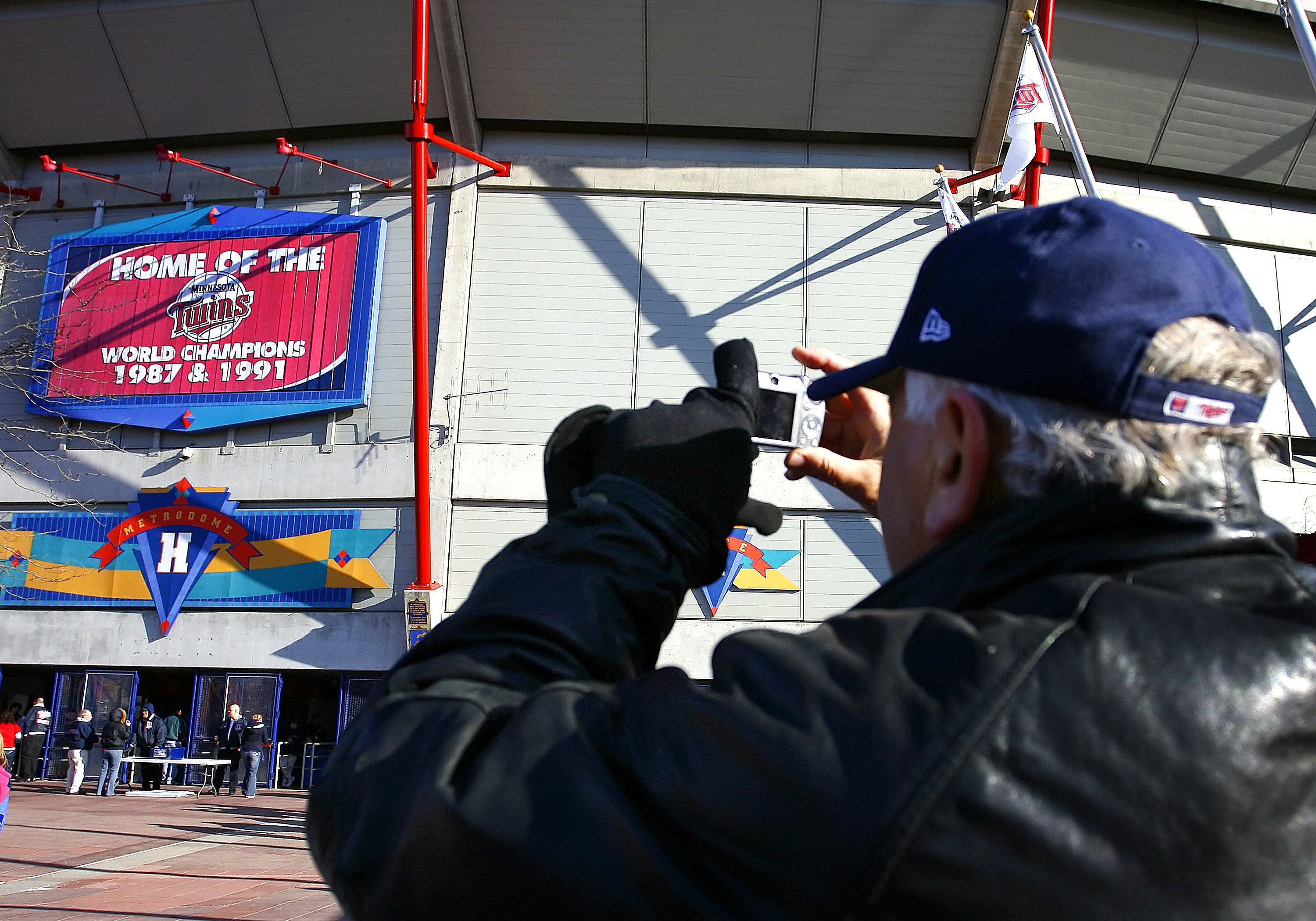 MINNEAPOLIS, MN - APRIL 6: A fan takes a picture of the Metrodome, the Minnesota Twins home in Minneapolis, Minnesota April 6, 2009. It's the last home opener for the Twins at the Metrodome; they'll open at the new Target Field, also in Minneapolis, in 20