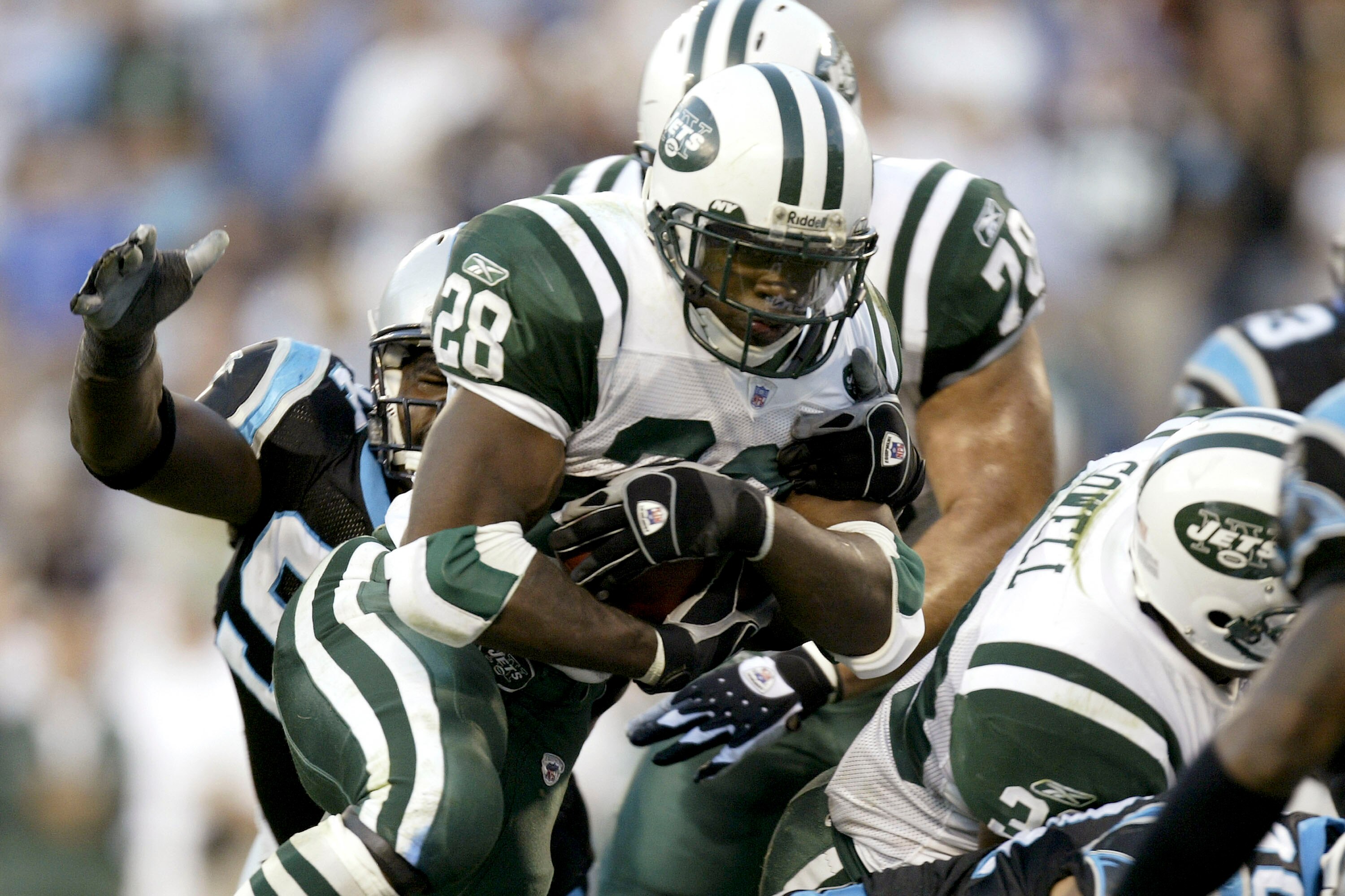 CHARLOTTE, NC - NOVEMBER 13:  Curtis Martin #28 of the New York Jets is stopped by the Carolina Panthers defense at Bank of America Stadium on November 13, 2005 in Charlotte, North Carolina.  (Photo by Craig Jones/Getty Images)