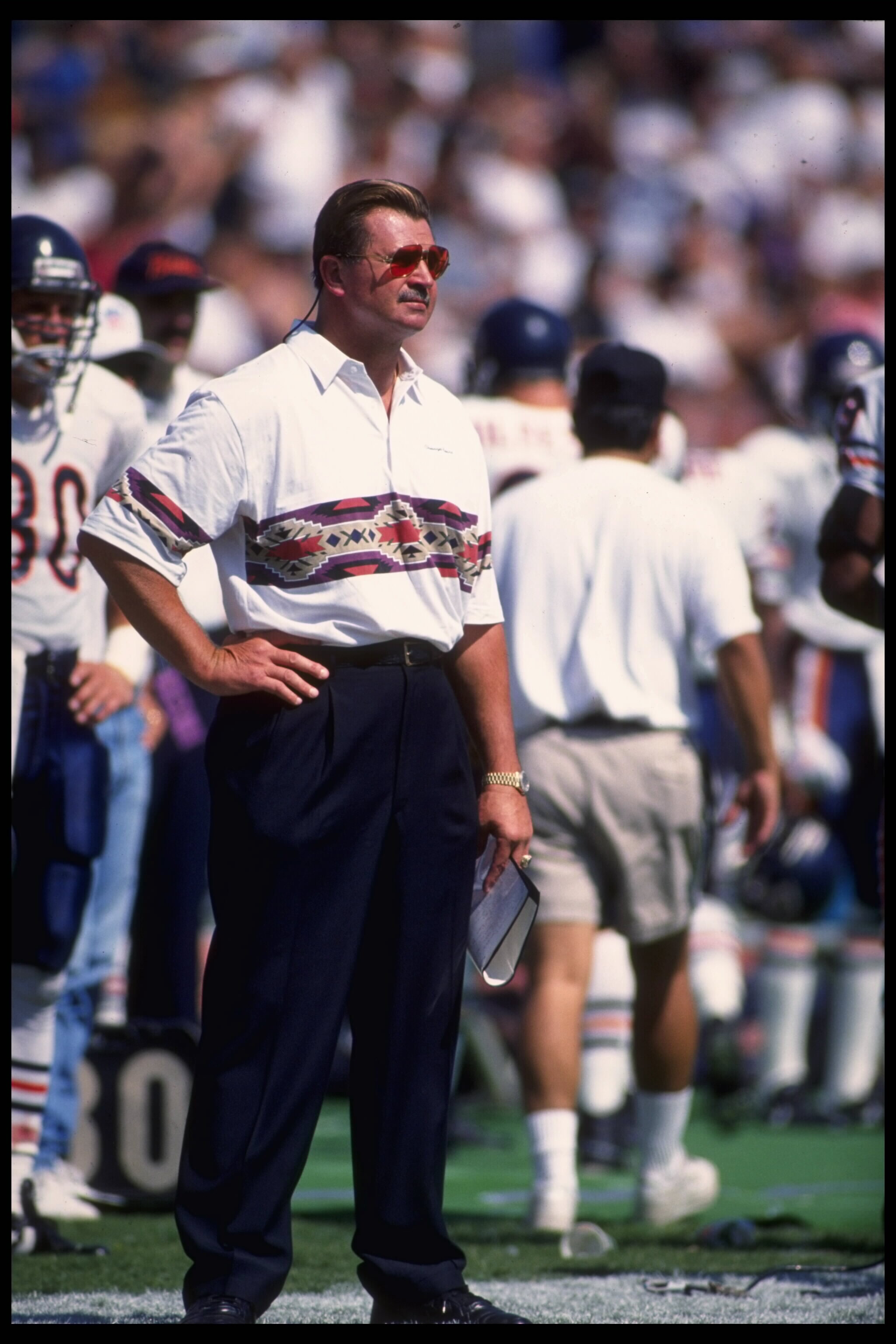 30 Sep 1990: Head coach Mike Ditka of the Chicago Bears watches his team from the sideline at Soldier Field in Chicago, Illinois, as they play the Los Angeles Raiders. The Raiders defeated the Bears 24-10.