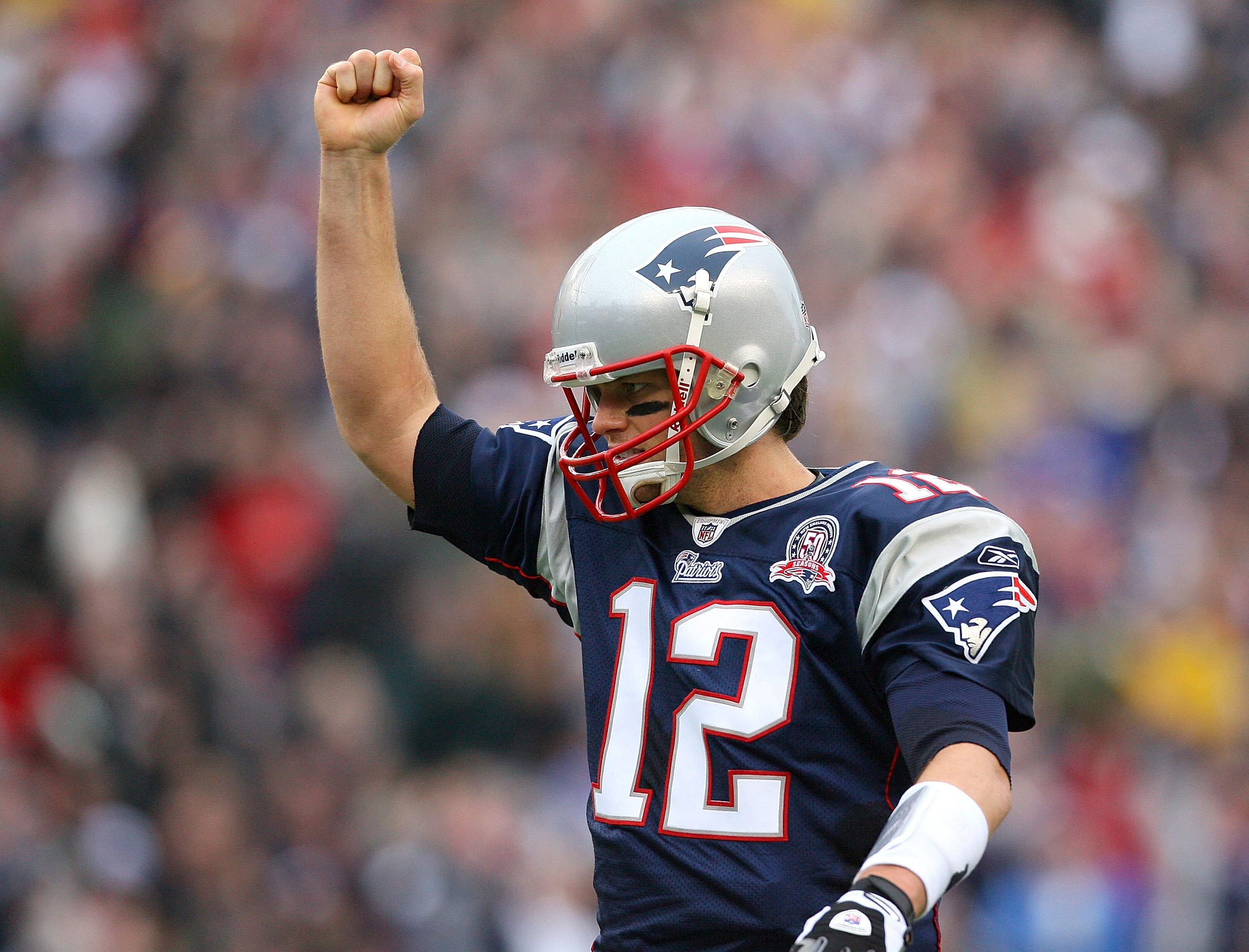 FOXBORO, MA - DECEMBER 27:  Tom Brady #12 of the New England Patriots reacts after a touchdown in the second quarter against the Jacksonville Jaguars at Gillette Stadium on December 27, 2009 in Foxboro, Massachusetts. (Photo by Jim Rogash/Getty Images)