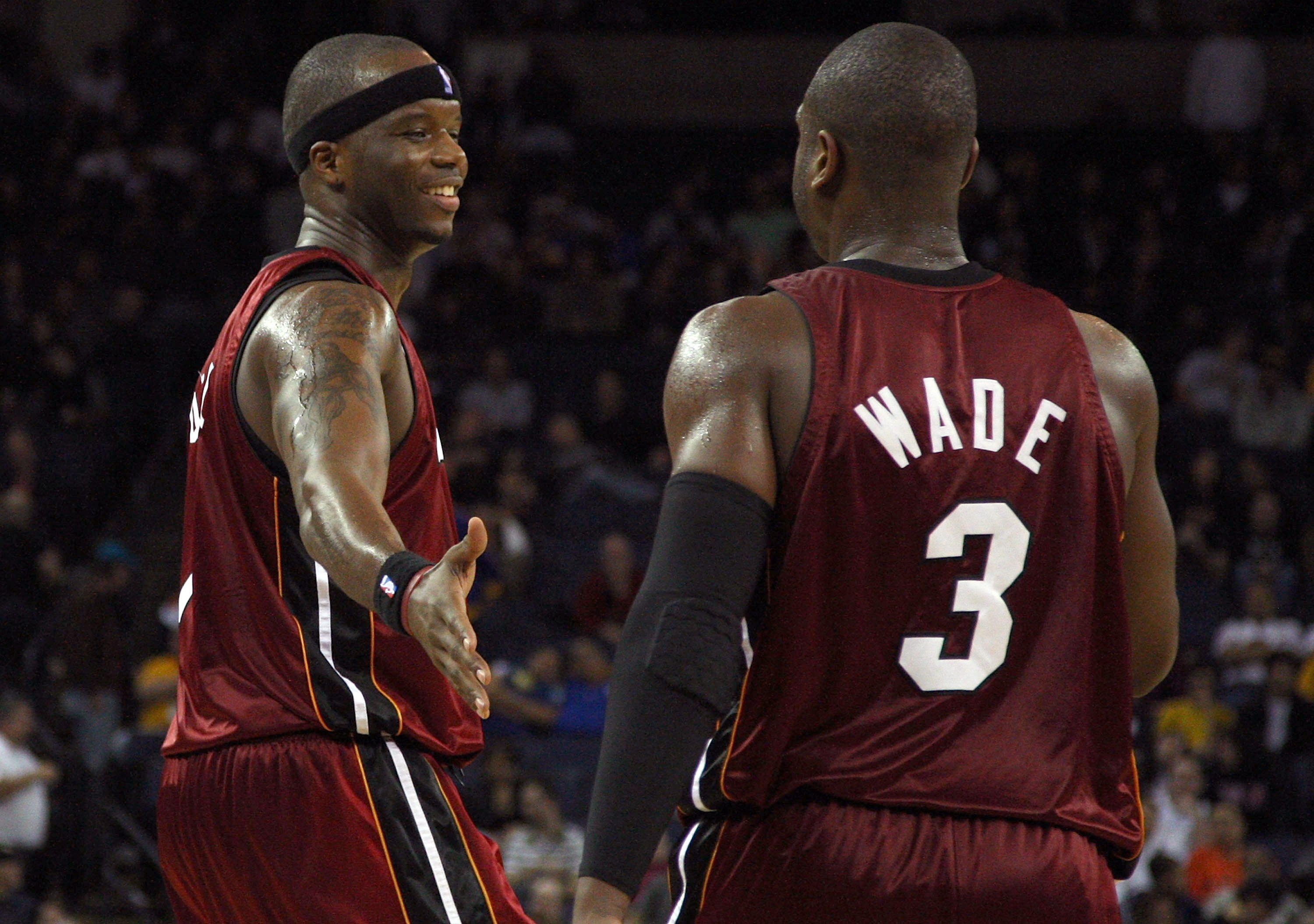 OAKLAND, CA - JANUARY 13:  Jermaine O'Neal #7 of the Miami Heat celebrates with teammate Dwyane Wade #3  during an NBA game against the Golden State Warriors at Oracle Arena on January 13, 2010 in Oakland, California.  NOTE TO USER: User expressly acknowl