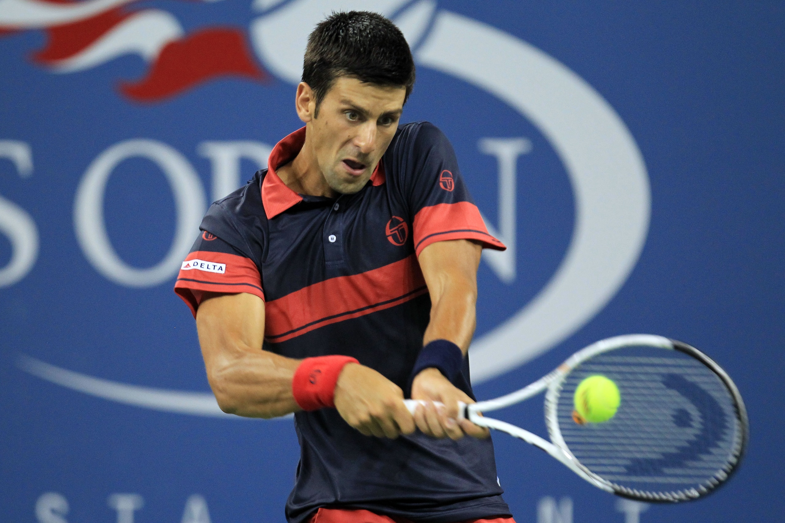 NEW YORK - SEPTEMBER 02:  Novak Djokovic of Serbia returns a shot against Philipp Petzschner Germany (not pictured) during day four of the 2010 U.S. Open at the USTA Billie Jean King National Tennis Center on September 2, 2010 in the Flushing neighborhood