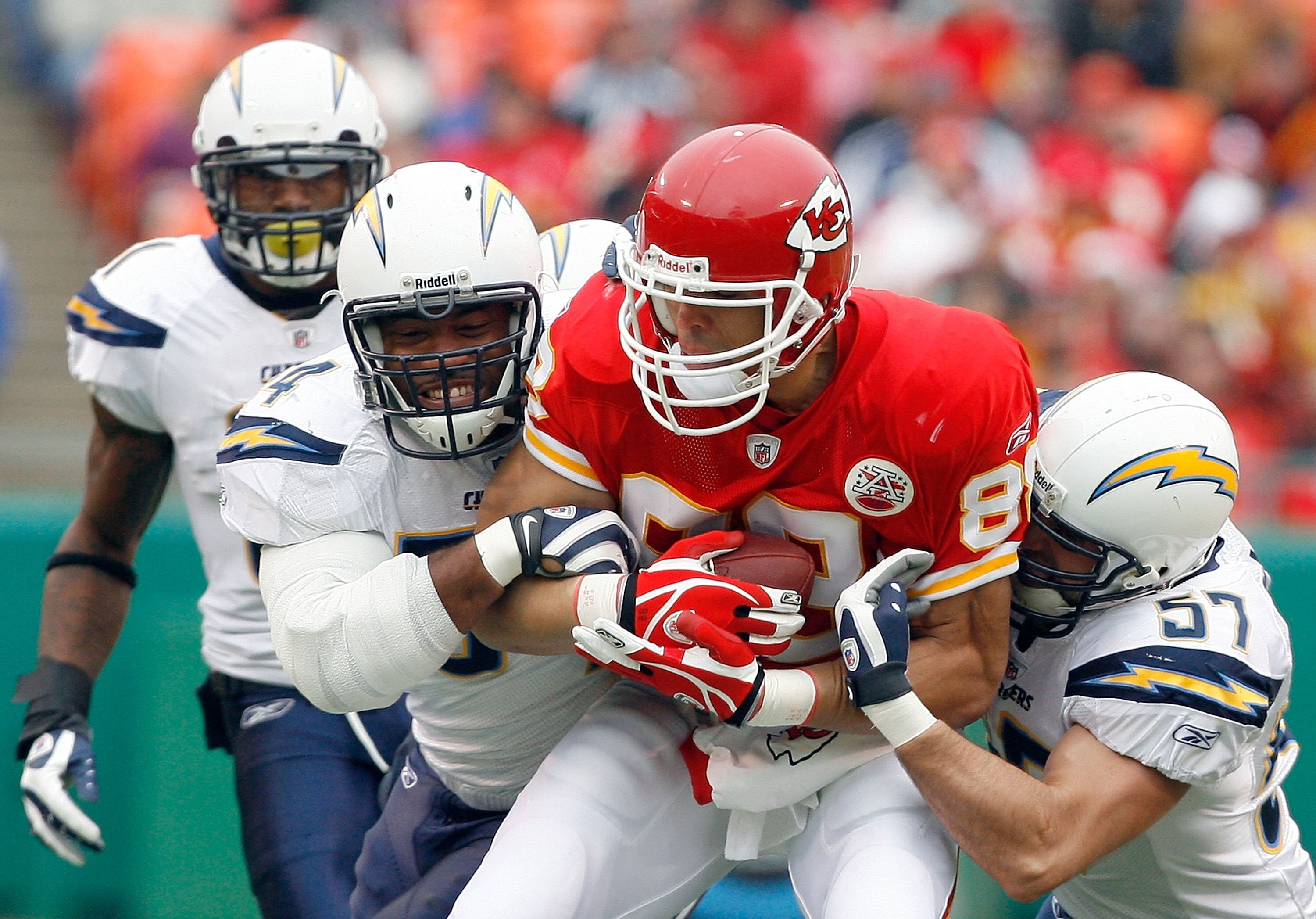 KANSAS CITY, MO - DECEMBER 14:  Tony Gonzalez #88 of the Kansas City Chiefs is tackled by Stephen Cooper #54 and Matt Wilhelm #57 of the San Diego Chargers during the first half on December 14, 2008 at Arrowhead Stadium in Kansas City, Missouri.  (Photo b