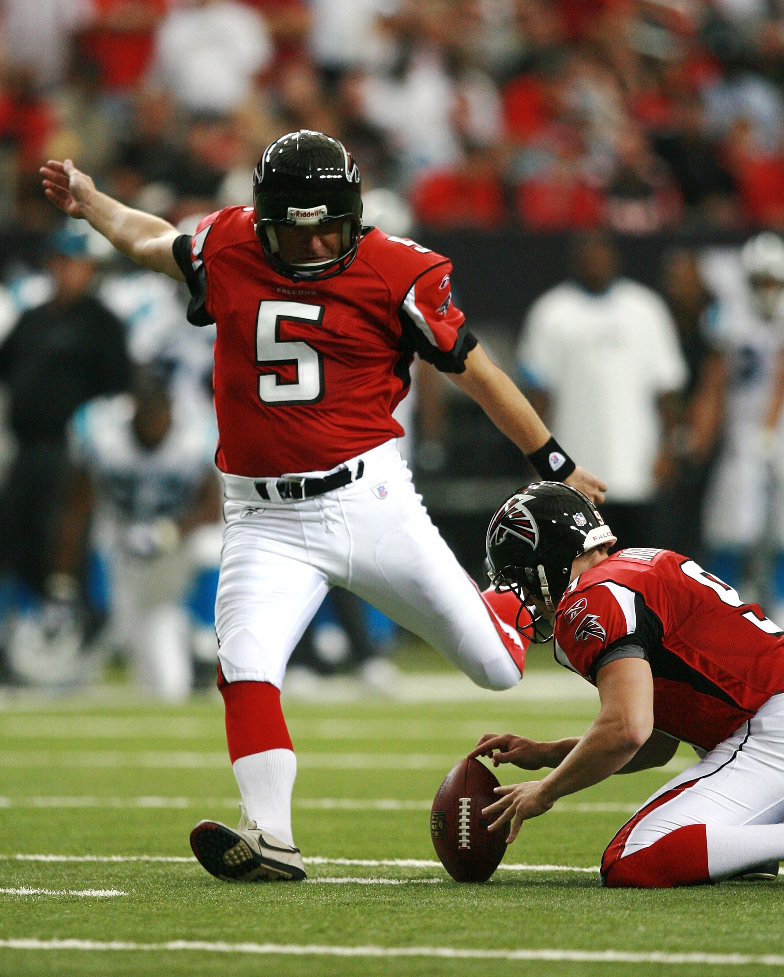 ATLANTA - SEPTEMBER 23:  Place kicker Morten Andersen #5 of the Atlanta Falcons kicks a field goal out of the hold by Michael Koenen #9 against the Carolina Panthers at Georgia Dome September 23, 2007 in Atlanta, Georgia. The Panthers defeated the Falcons