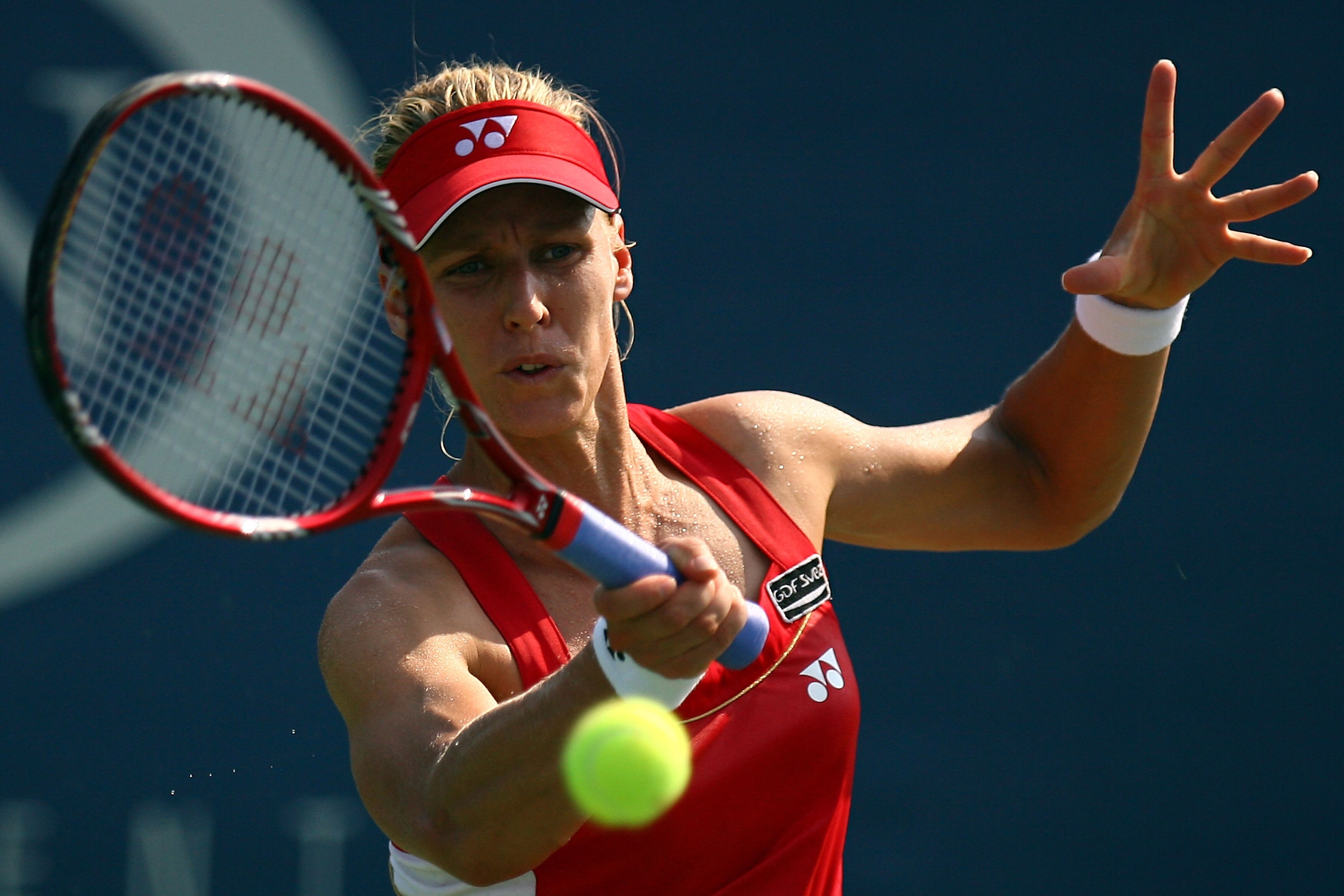 NEW YORK - SEPTEMBER 01:  Elena Dementieva of Russia hits a return against Sybille Bammer of Austria during her second round women's singles match on day three of the 2010 U.S. Open at the USTA Billie Jean King National Tennis Center on September 1, 2010