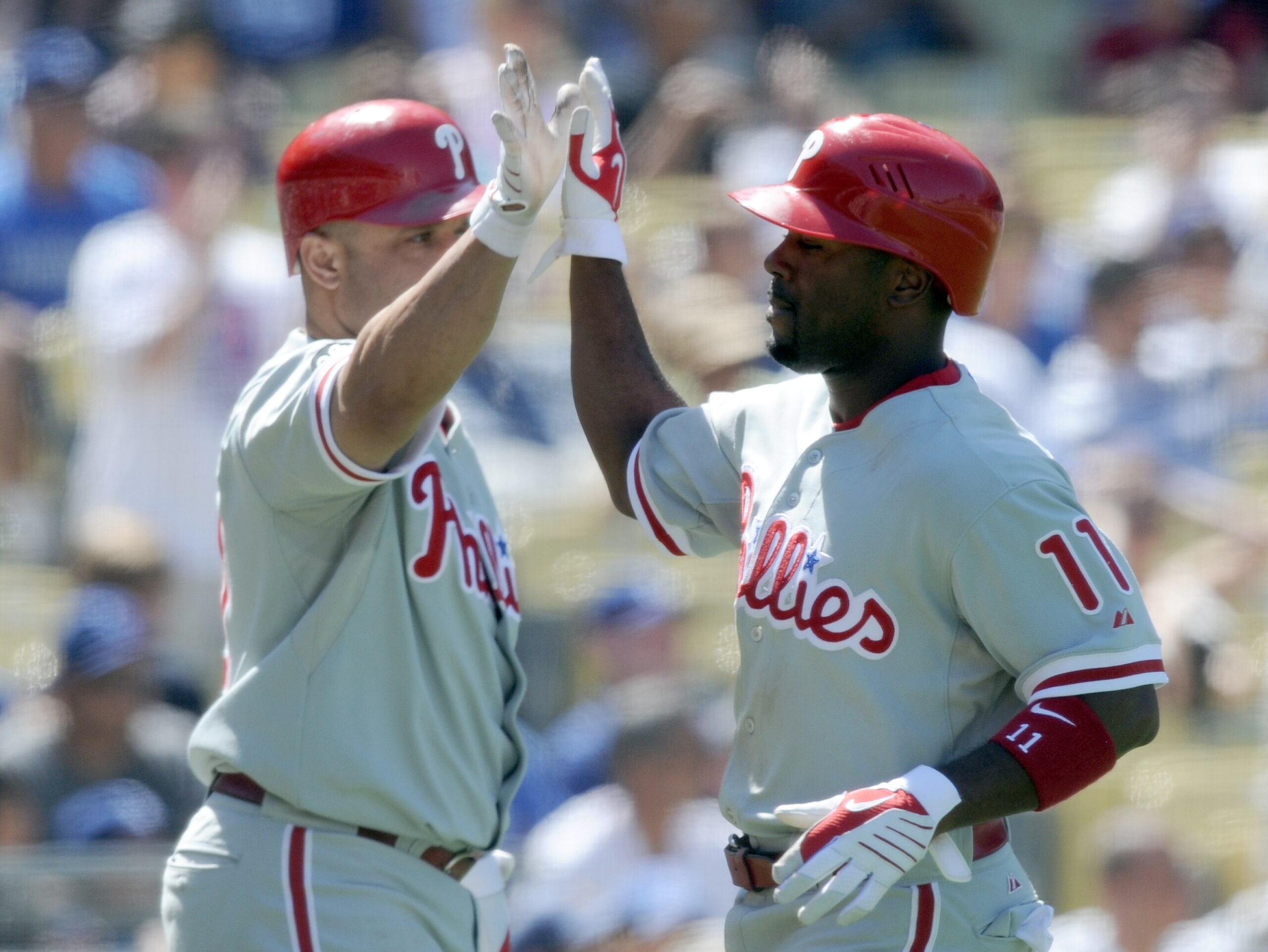 LOS ANGELES, CA - SEPTEMBER 01: Jimmy Rollins #11 of the Philadelphia Phillies celebrates his run with Placido Polanco #27 off of a Chase Utley #26 double for a 3-0 lead over the Los Angeles Dodgers during the seventh inning at Dodger Stadium on Septembe LOS ANGELES, CA - SEPTEMBER 01: Jimmy Rollins #11 of the Philadelphia Phillies celebrates his run with Placido Polanco #27 off of a Chase Utley #26 double for a 3-0 lead over the Los Angeles Dodgers during the seventh inning at Dodger Stadium on Septembe