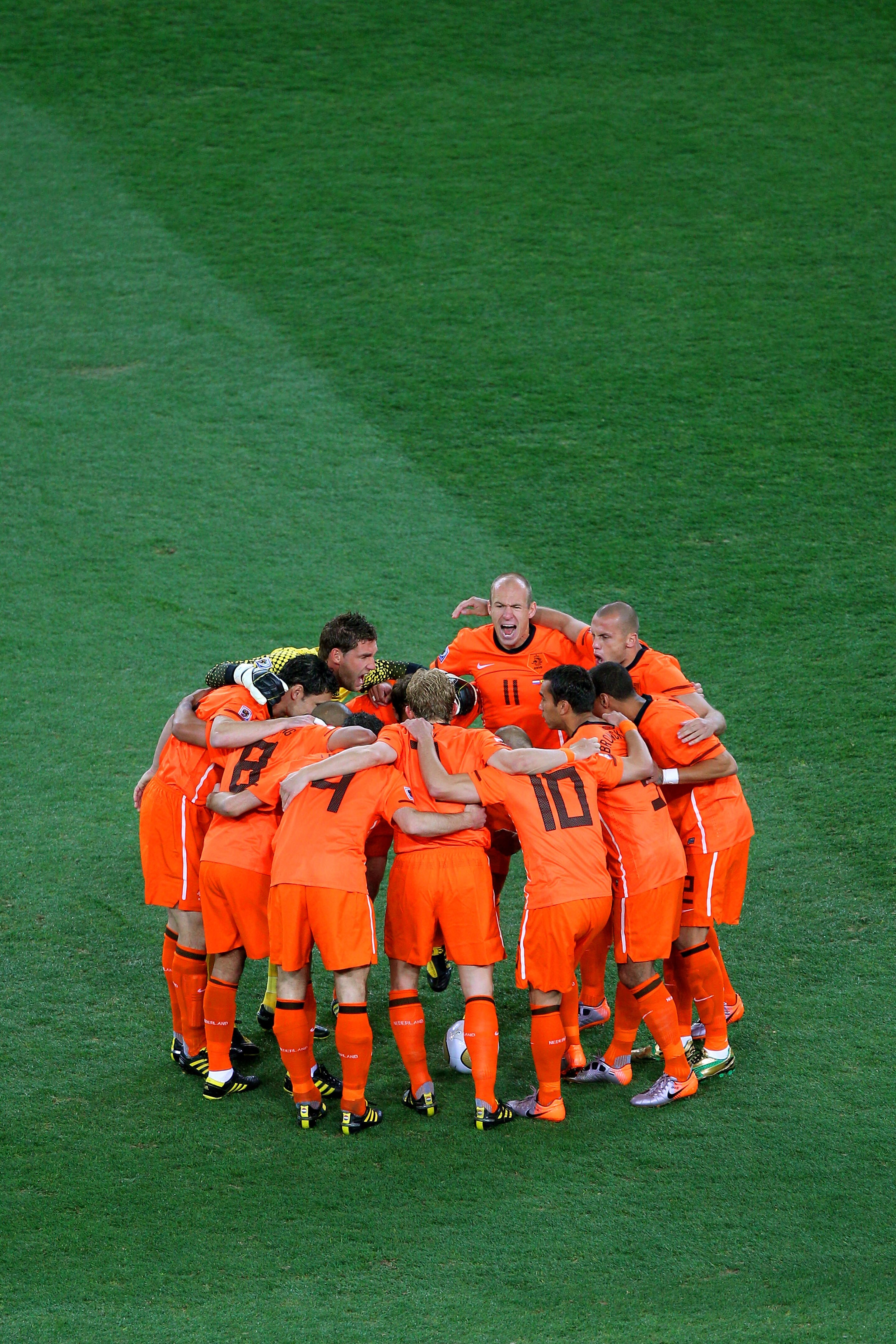 JOHANNESBURG, SOUTH AFRICA - JULY 11:  Arjen Robben of the Netherlands shouts encouragement to his team mates in the huddle ahead of the 2010 FIFA World Cup South Africa Final match between Netherlands and Spain at Soccer City Stadium on July 11, 2010 in
