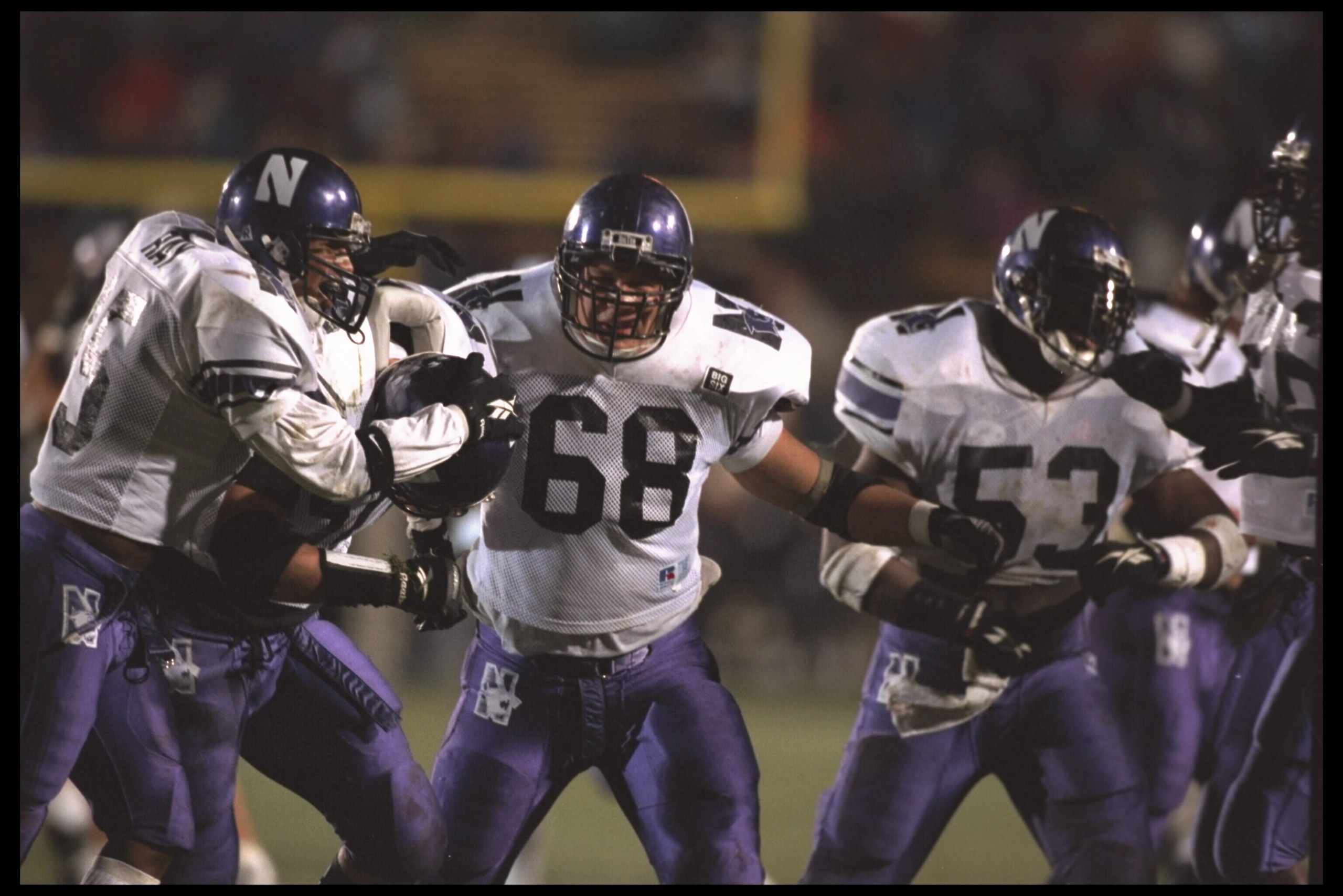 18 Nov 1995:  From left to right:  Rodney Ray, Pat Fitzgerald, Mike Warren #68 and Don Holmes #53 of the Northwestern Wildcats in action during the Wildcats 23-8 victory over the Purdue Boilermakers at Ross-Ade Stadium in Lafayette, Indiana.  Mandatory Cr