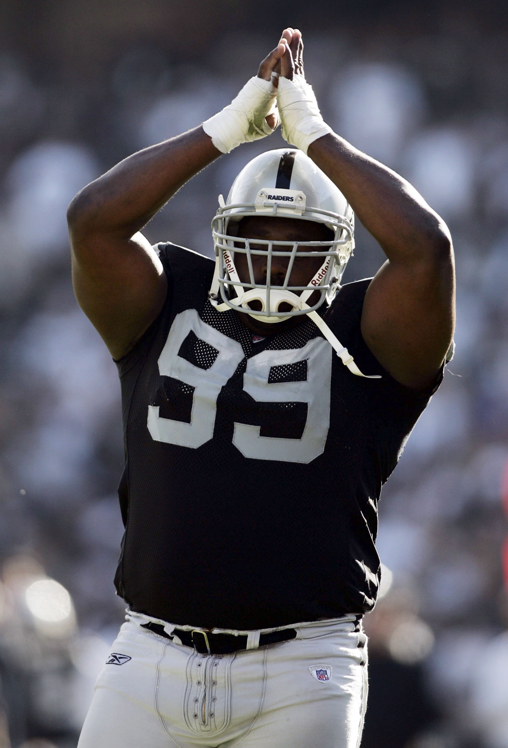 OAKLAND, CA - OCTOBER 22:  Warren Sapp #99 of the Oakland Raiders celebrates during the game against the Arizona Cardinals on October 22, 2006 at McAfee Coliseum in Oakland, California.  (Photo by Jonathan Ferrey/Getty Images)