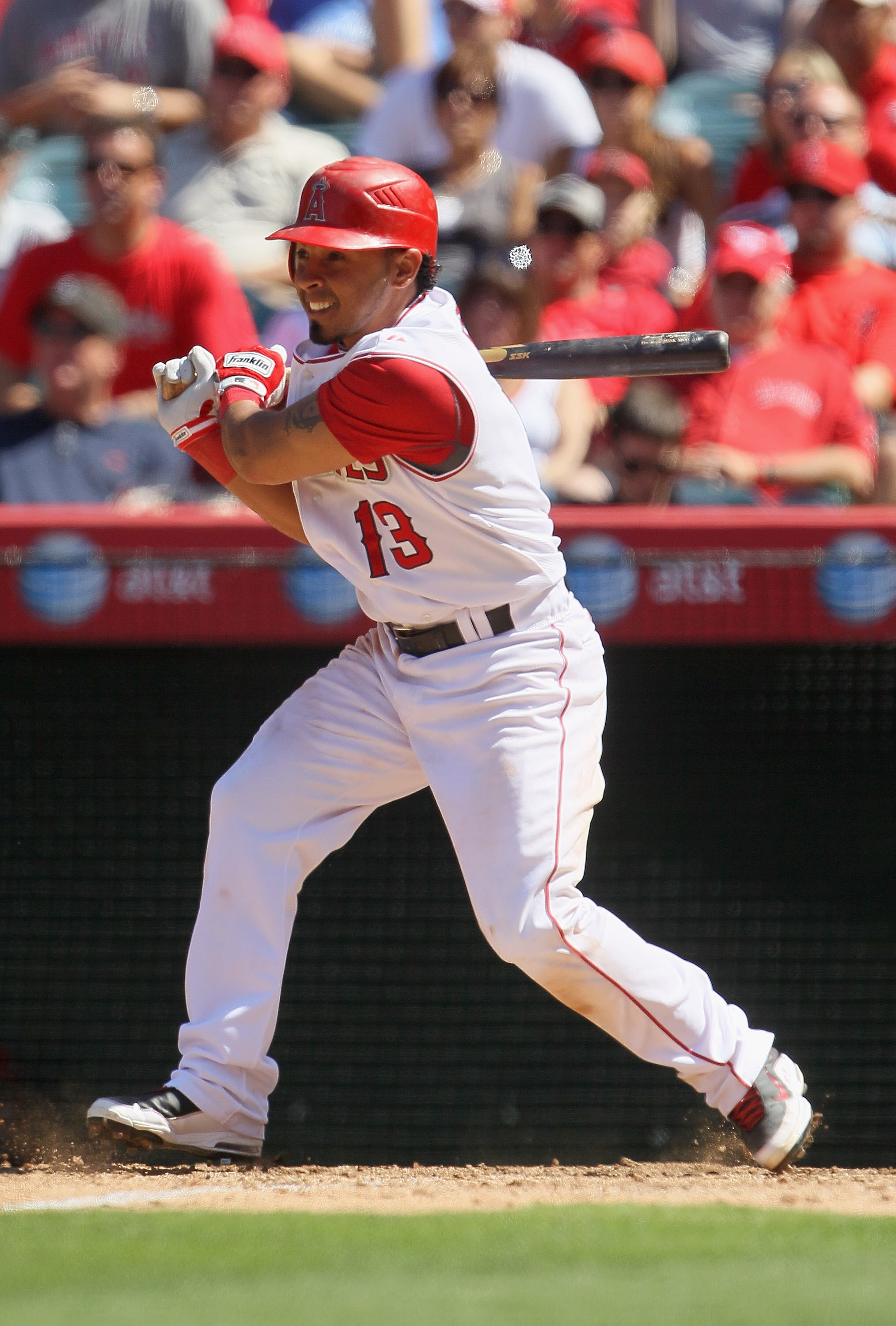 ANAHEIM, CA - AUGUST 11:  Maicer Izturis #13 of the Los Angeles Angels of Anaheim hits a single in the ninth inning against the Kansas City Royals at Angel Stadium on August 11, 2010 in Anaheim, California.  The Angels defeated the Royals 2-1 in ten innin