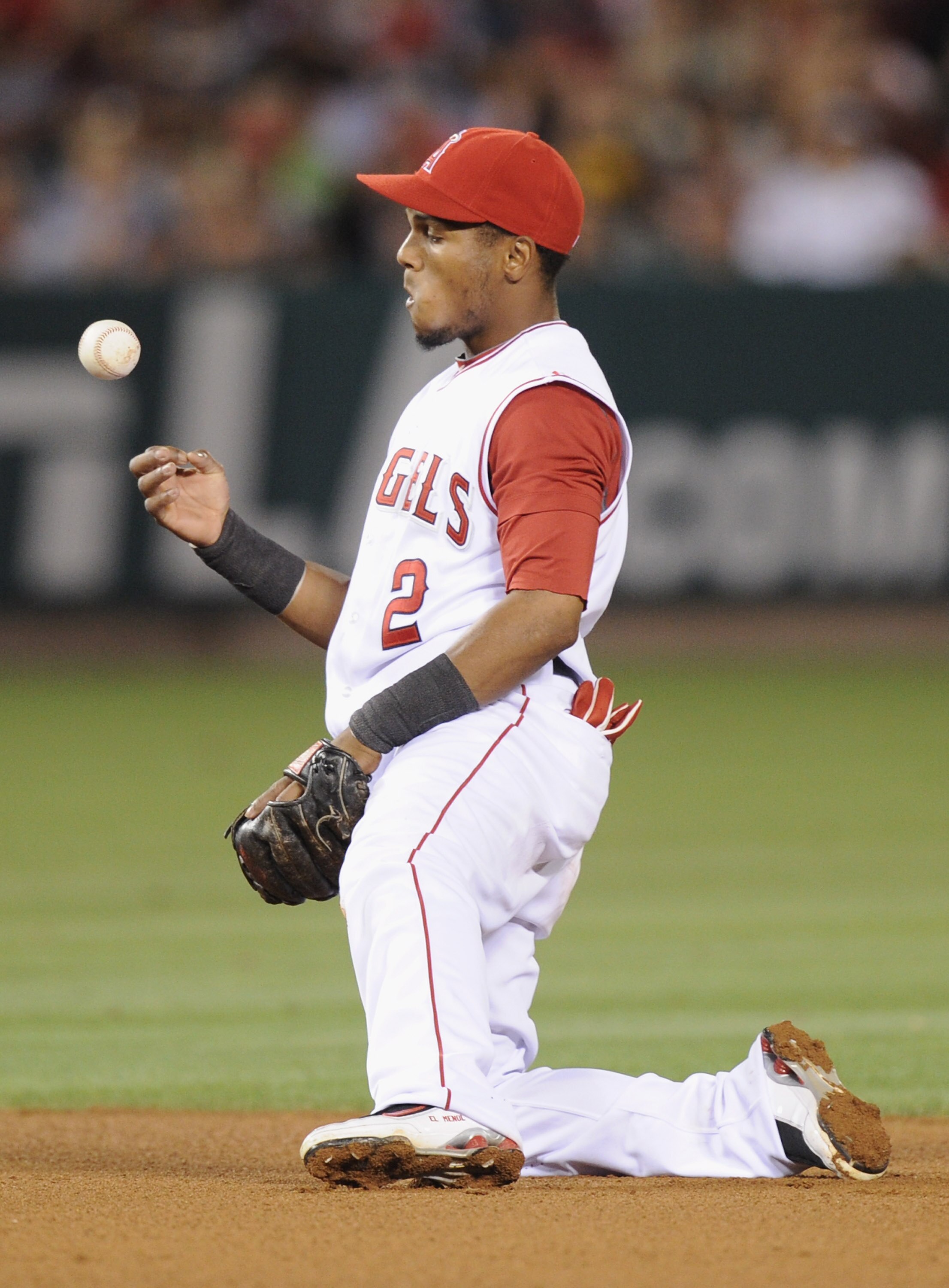 ANAHEIM, CA - AUGUST 13:  Erick Aybar #2 of the Los Angeles Angels reacts after mishandling a ground ball from Yunel Escobar #5 of the Toronto Blue Jays during the seventh inning at Angel Stadium on August 13, 2010 in Anaheim, California.  (Photo by Harry