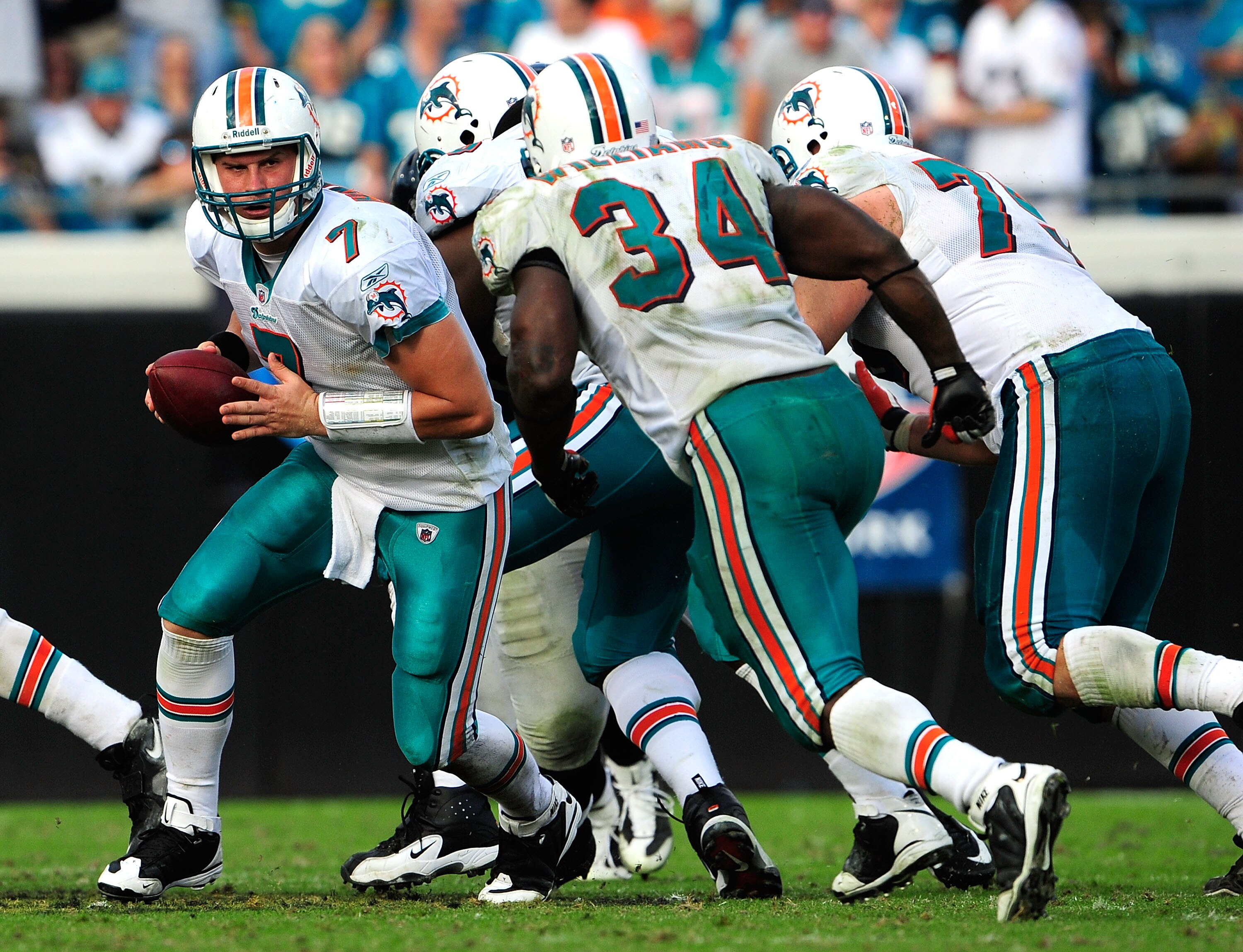 JACKSONVILLE, FL - DECEMBER 13:  Chad Henne #7 of the Miami Dolphins hands the ball off to Ricky Williams #34 during the game against the Jacksonville Jaguars at Jacksonville Municipal Stadium on December 13, 2009 in Jacksonville, Florida.  The Dolphins w