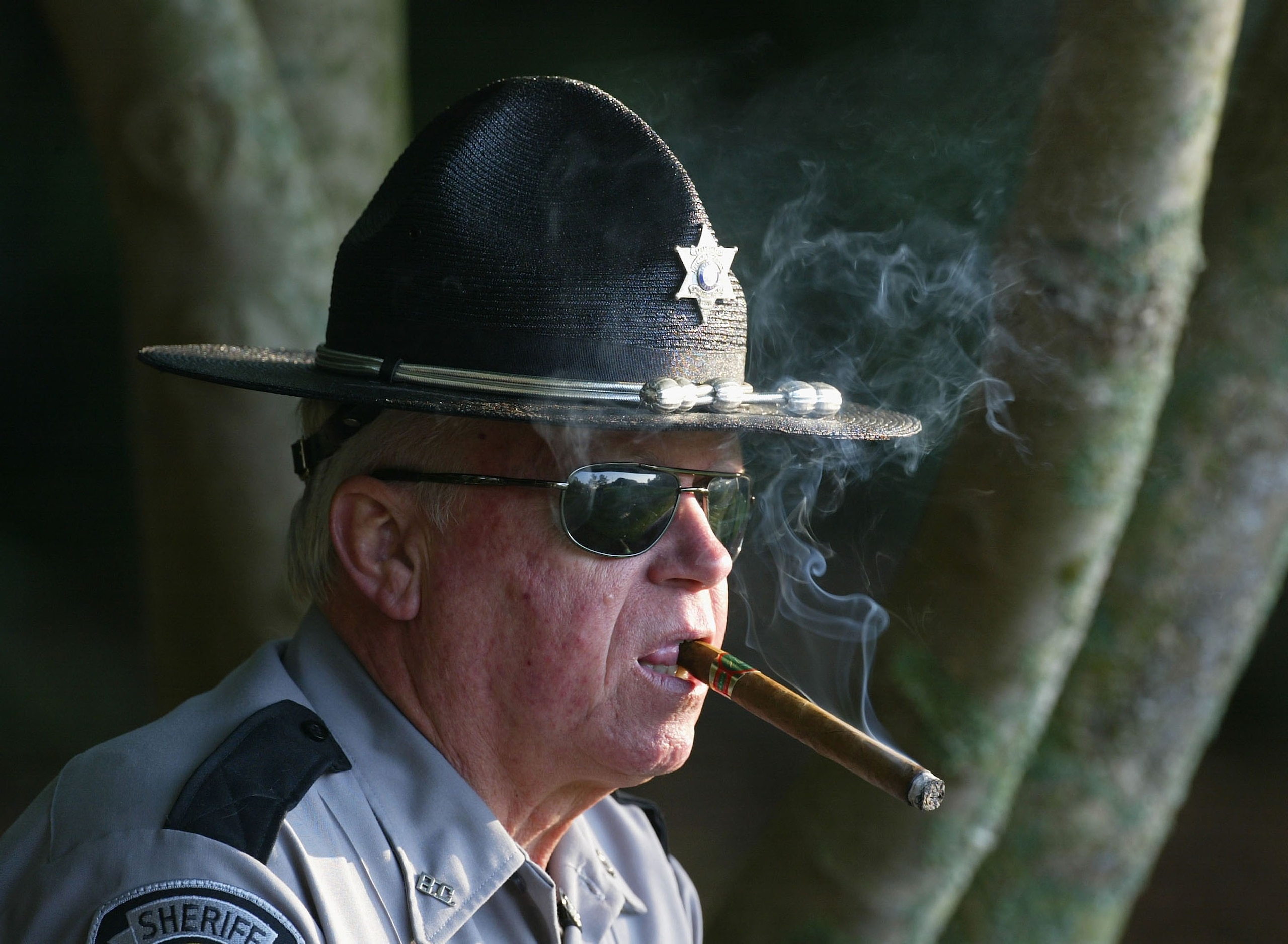 AUGUSTA, GA - APRIL 9:  A Sheriff's deputy watches during the completion of the first round of the Masters at the Augusta National Golf Club on April 9, 2004 in Augusta, Georgia.  (Photo by David Cannon/Getty Images)