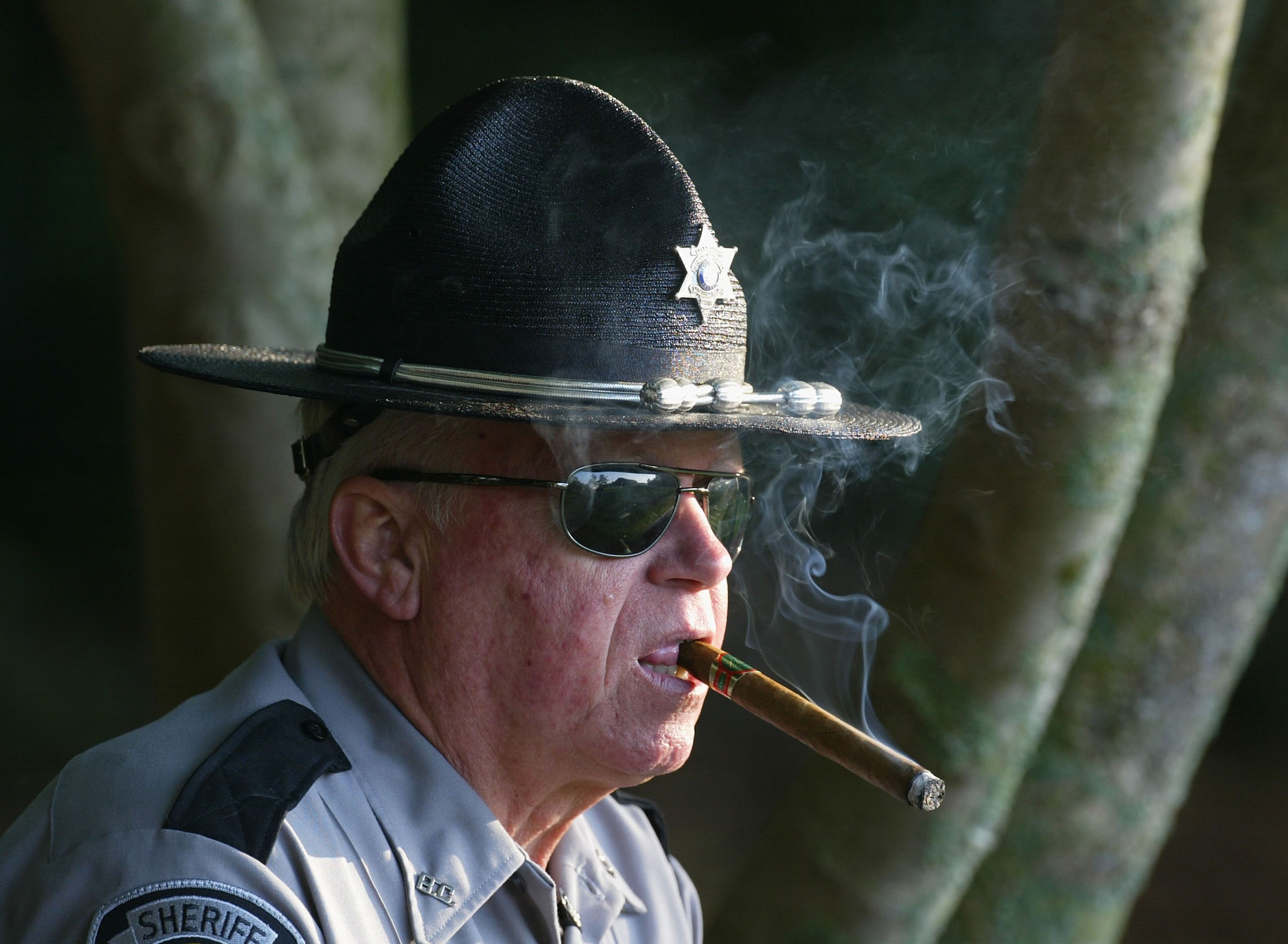 AUGUSTA, GA - APRIL 9:  A Sheriff's deputy watches during the completion of the first round of the Masters at the Augusta National Golf Club on April 9, 2004 in Augusta, Georgia.  (Photo by David Cannon/Getty Images)