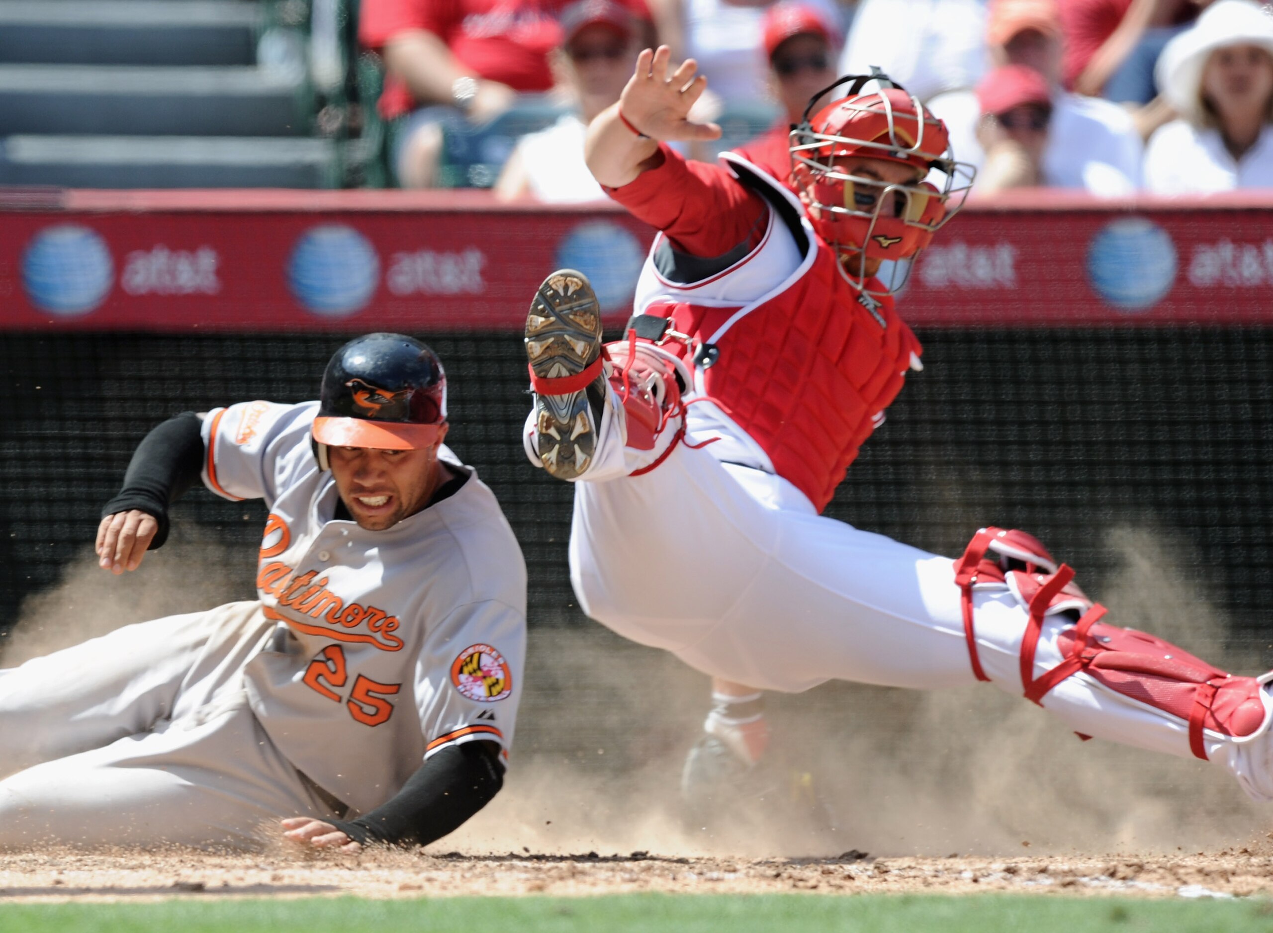 ANAHEIM, CA - AUGUST 29:  Josh Bell #25 f the Baltimore Orioles is tagged out at home plate by Jeff Mathis #5 of the Los Angeles Angels of Anaheim during the sixth inning at Angel Stadium on August 29, 2010 in Anaheim, California.  (Photo by Harry How/Get