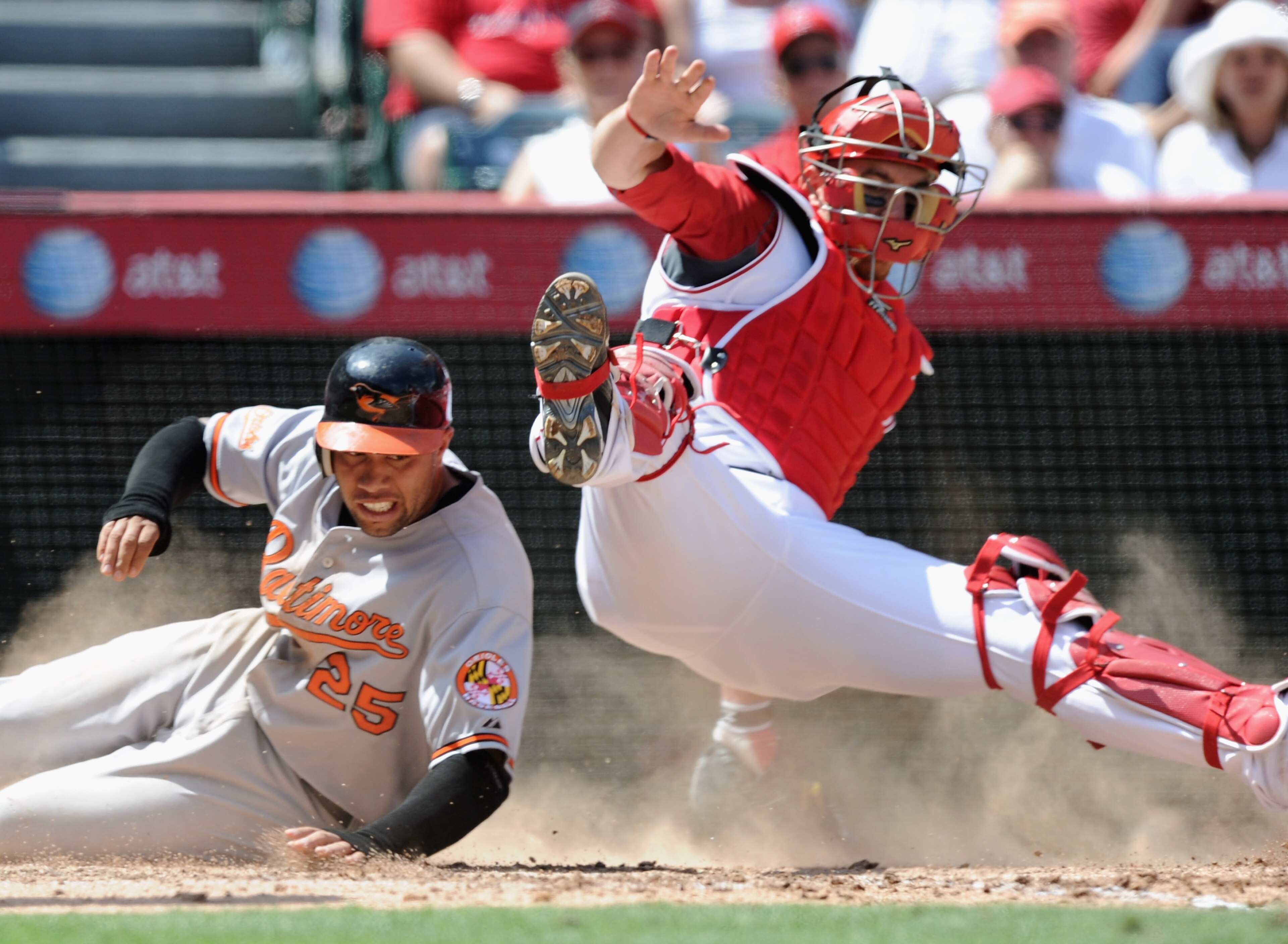 ANAHEIM, CA - AUGUST 29:  Josh Bell #25 f the Baltimore Orioles is tagged out at home plate by Jeff Mathis #5 of the Los Angeles Angels of Anaheim during the sixth inning at Angel Stadium on August 29, 2010 in Anaheim, California.  (Photo by Harry How/Get