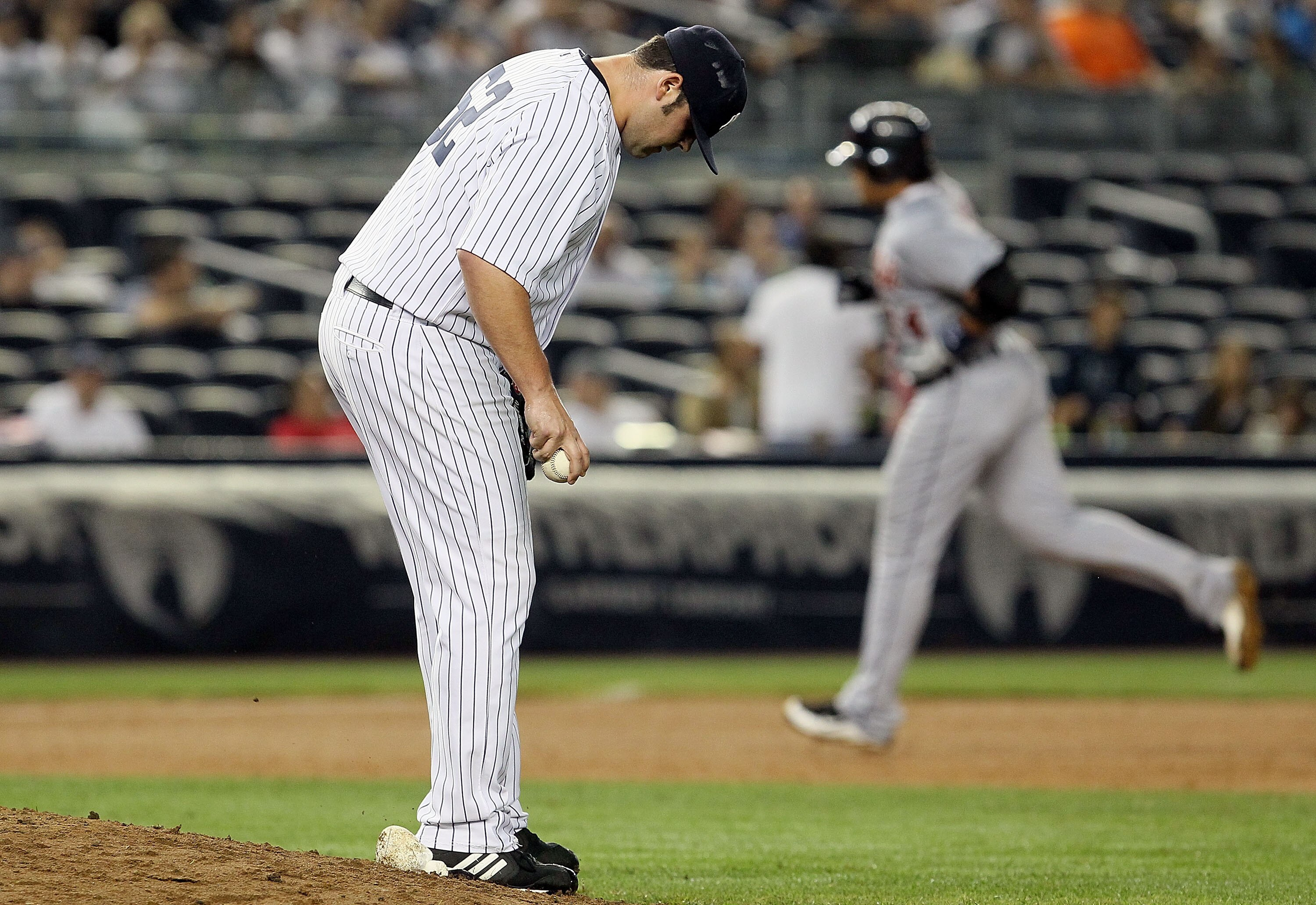 NEW YORK - AUGUST 16:  Joba Chamberlain #62 of the New York Yankees reacts after surrendering a ninth inning home run against Miguel Cabrera #24 of the Detroit Tigers on August 16, 2010 at Yankee Stadium in the Bronx borough of New York City. The Tigers d