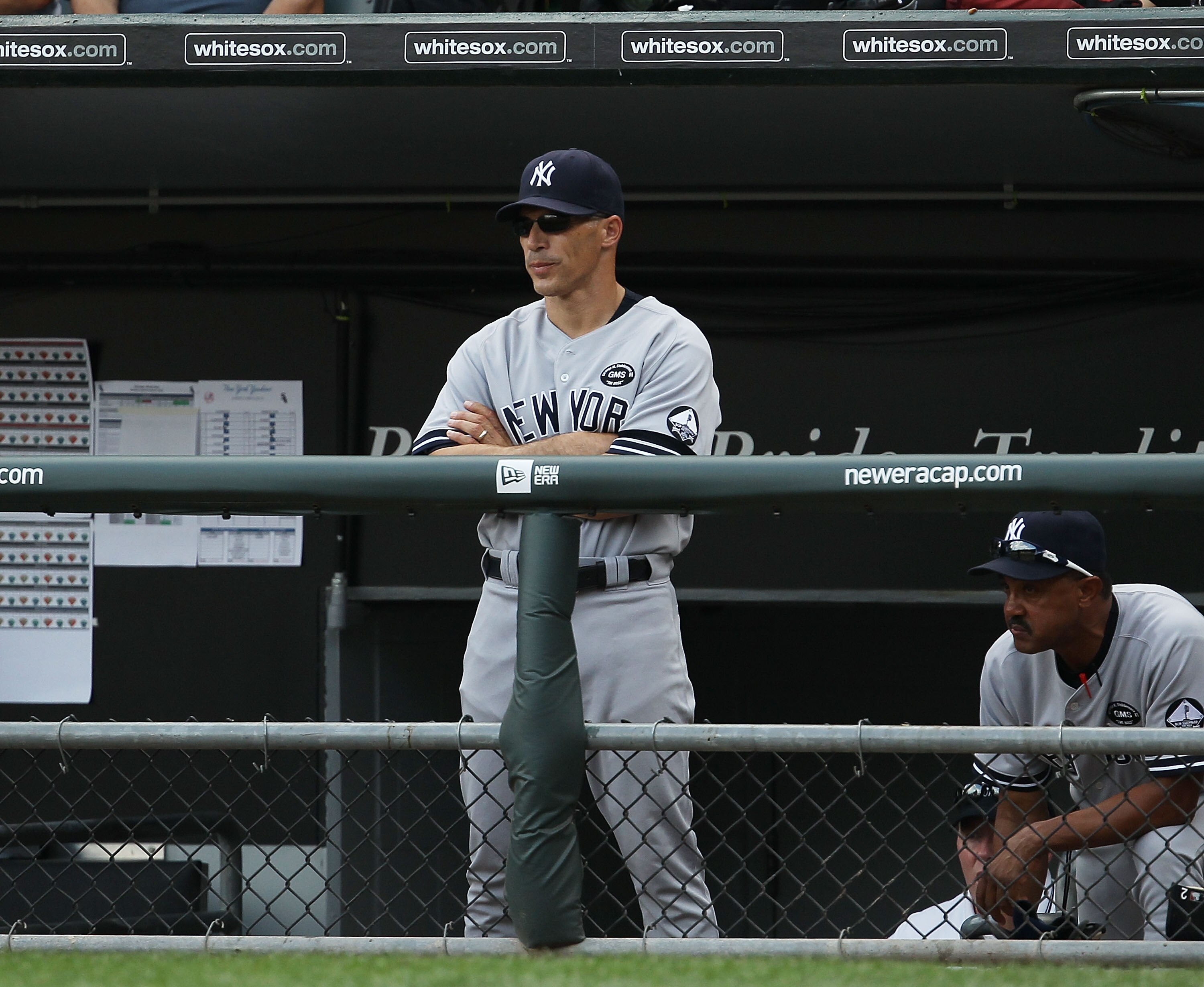 CHICAGO - AUGUST 29: Manager Joe Girardi #28 and bench coach Tony Pena # 56 of the New York Yankees watch their team take on the Chicago White Sox at U.S. Cellular Field on August 29, 2010 in Chicago, Illinois. The Yankees defeated the White Sox 2-1. (Pho