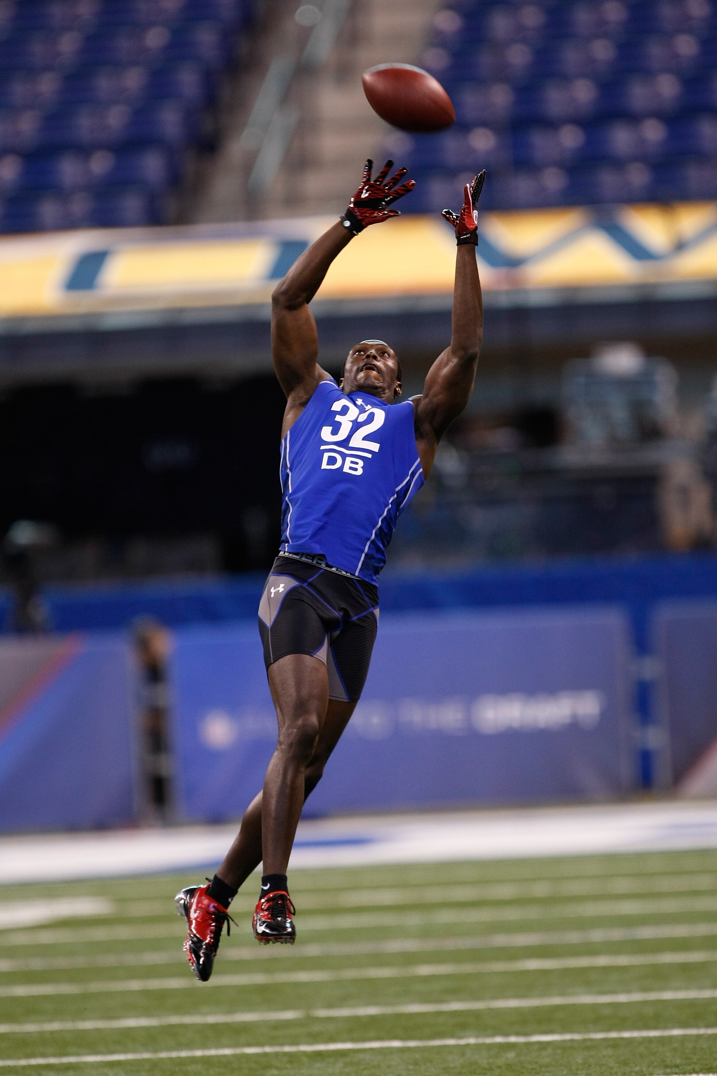 INDIANAPOLIS, IN - MARCH 2: Defensive back Devin McCourty of Rutgers jumps in the air to catch the football in drills during the NFL Scouting Combine presented by Under Armour at Lucas Oil Stadium on March 2, 2010 in Indianapolis, Indiana. (Photo by Scott