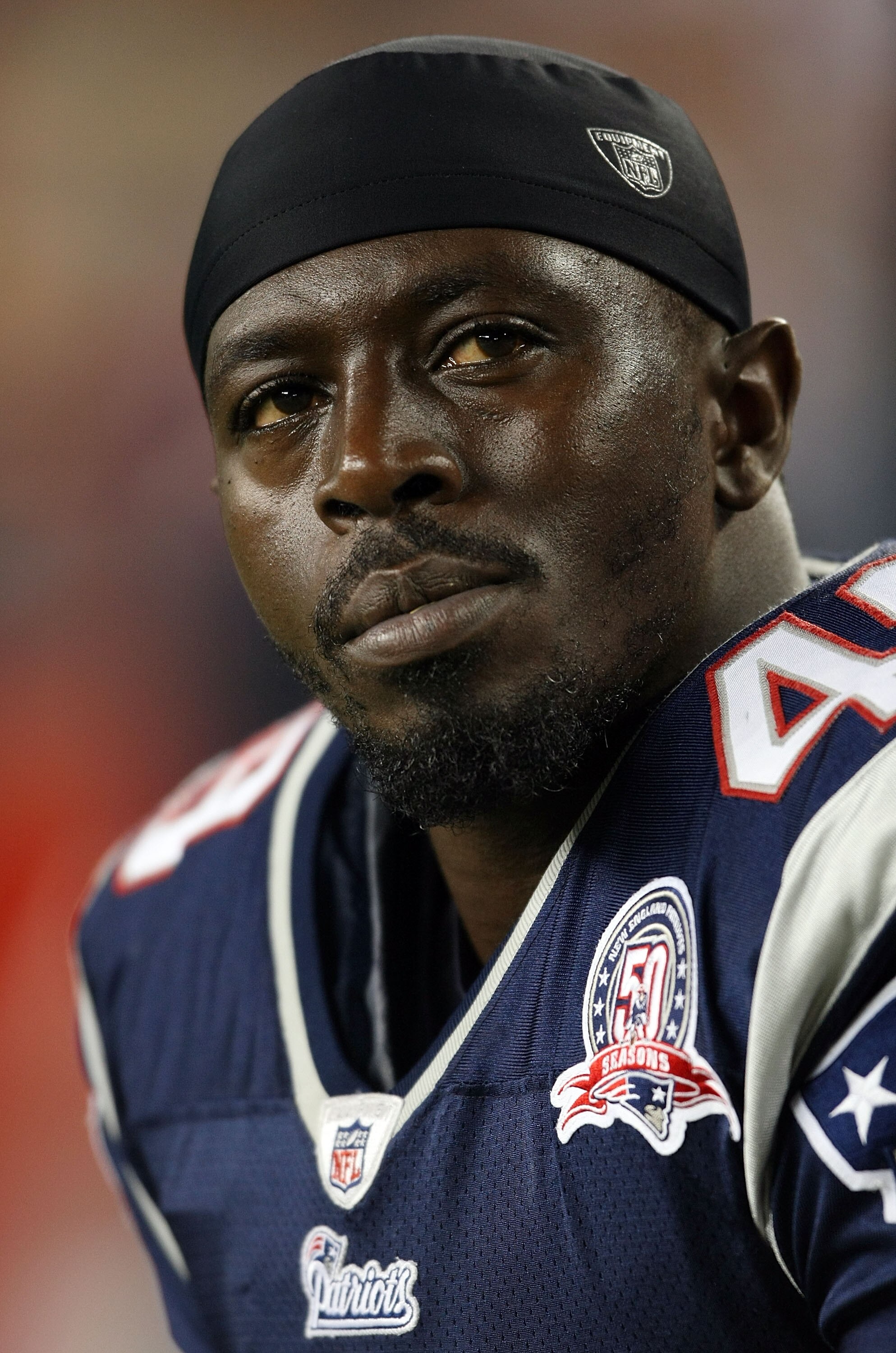 FOXBORO, MA - SEPTEMBER 03:  Derrick Burgess #49 of the New England Patriots looks on from the bench in the first half against the New York Giants on September 3, 2009 at Gillette Stadium in Foxboro, Massachusetts.  (Photo by Elsa/Getty Images)