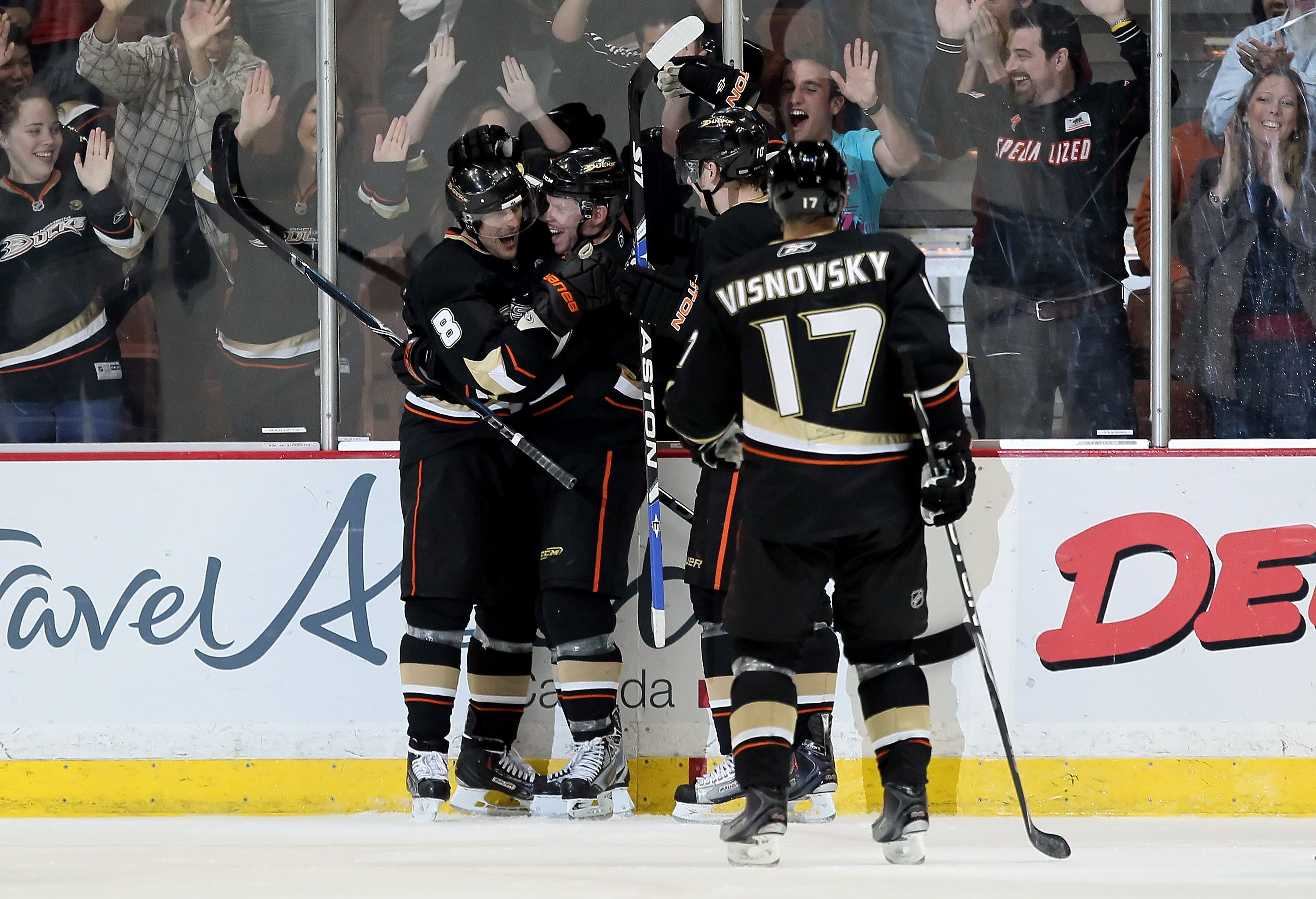 ANAHEIM, CA - APRIL 02:  (L-R) Teemu Sealanne #8, Saku Koivu #11, Corey Perry #10 and Lubomir Visnovsky #17 of the Anaheim Ducks celebrate Selanne's 602nd career goal in the second period against the Vancouver Canucks at the Honda Center on April 2, 2010 
